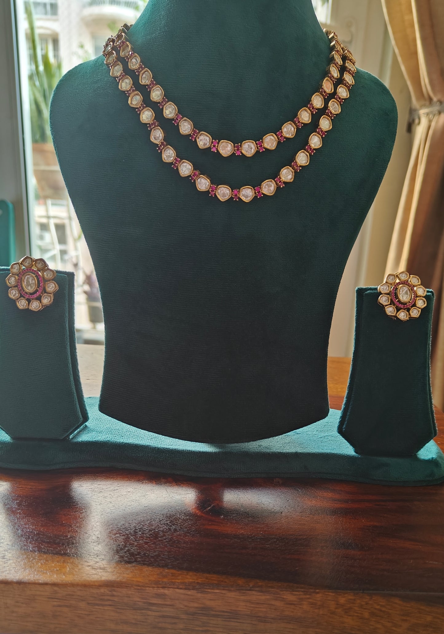 Anika set in Kundan and ruby/emerald stones