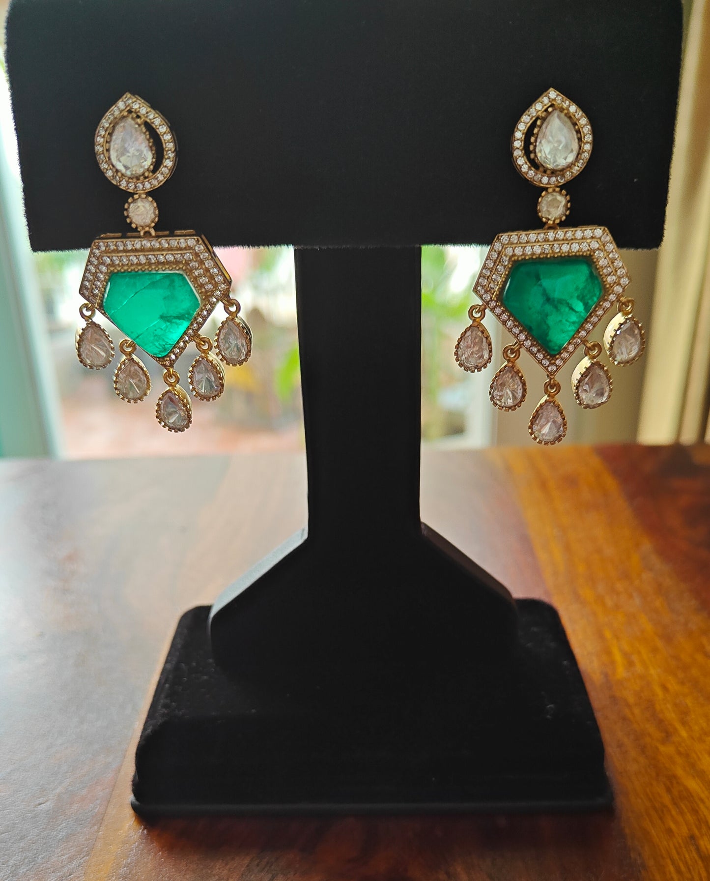 Nitya earrings with emerald green stone and moissanite