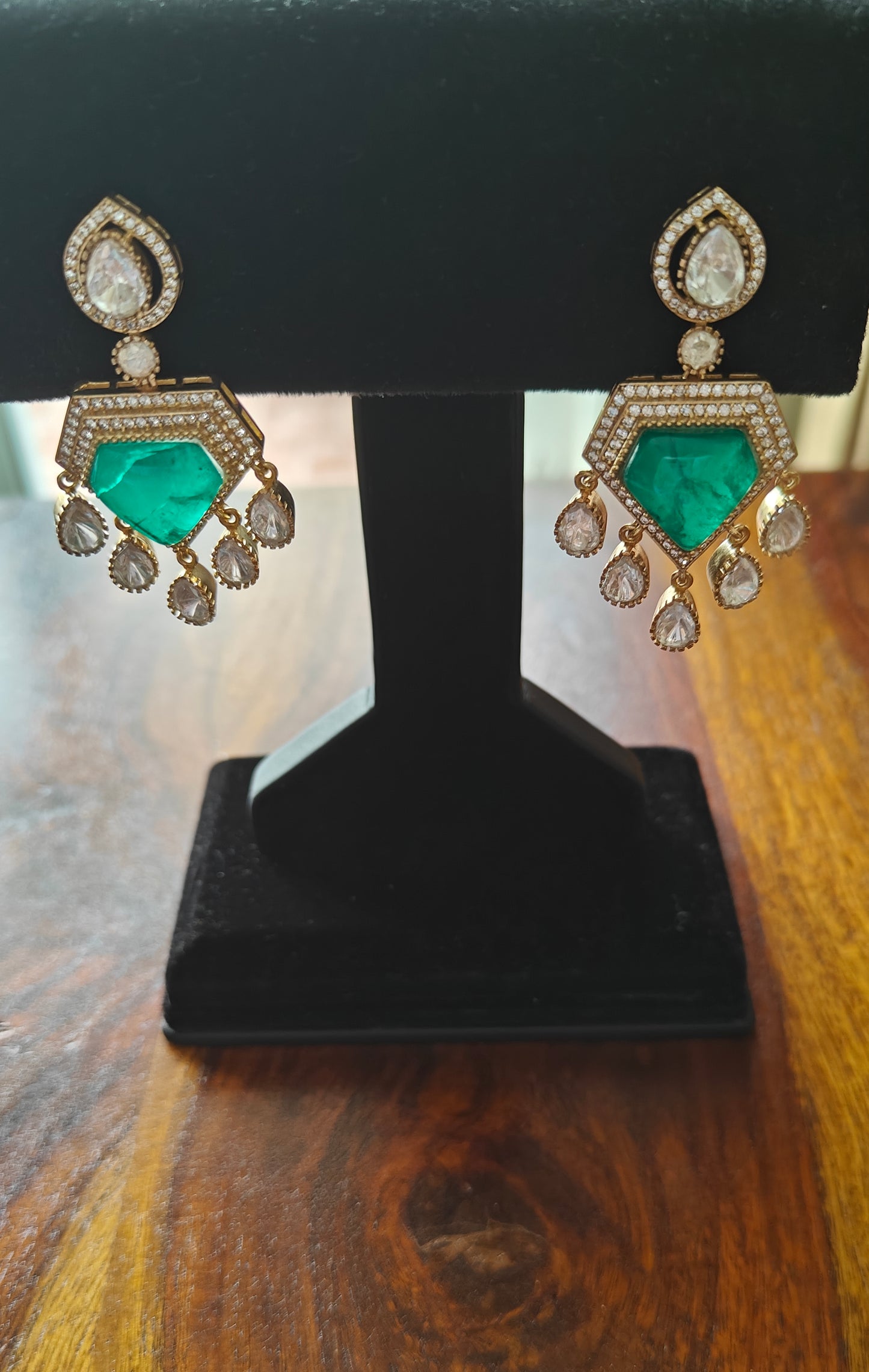 Nitya earrings with emerald green stone and moissanite
