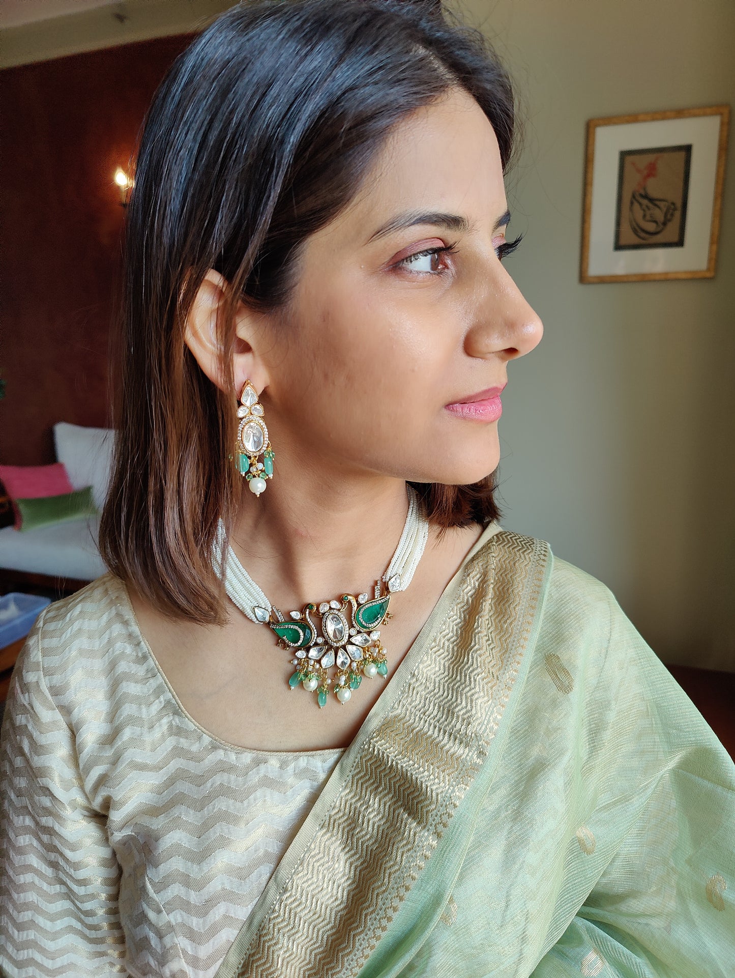 Deepta set with peacocks and moissanite on poth pearl strings
