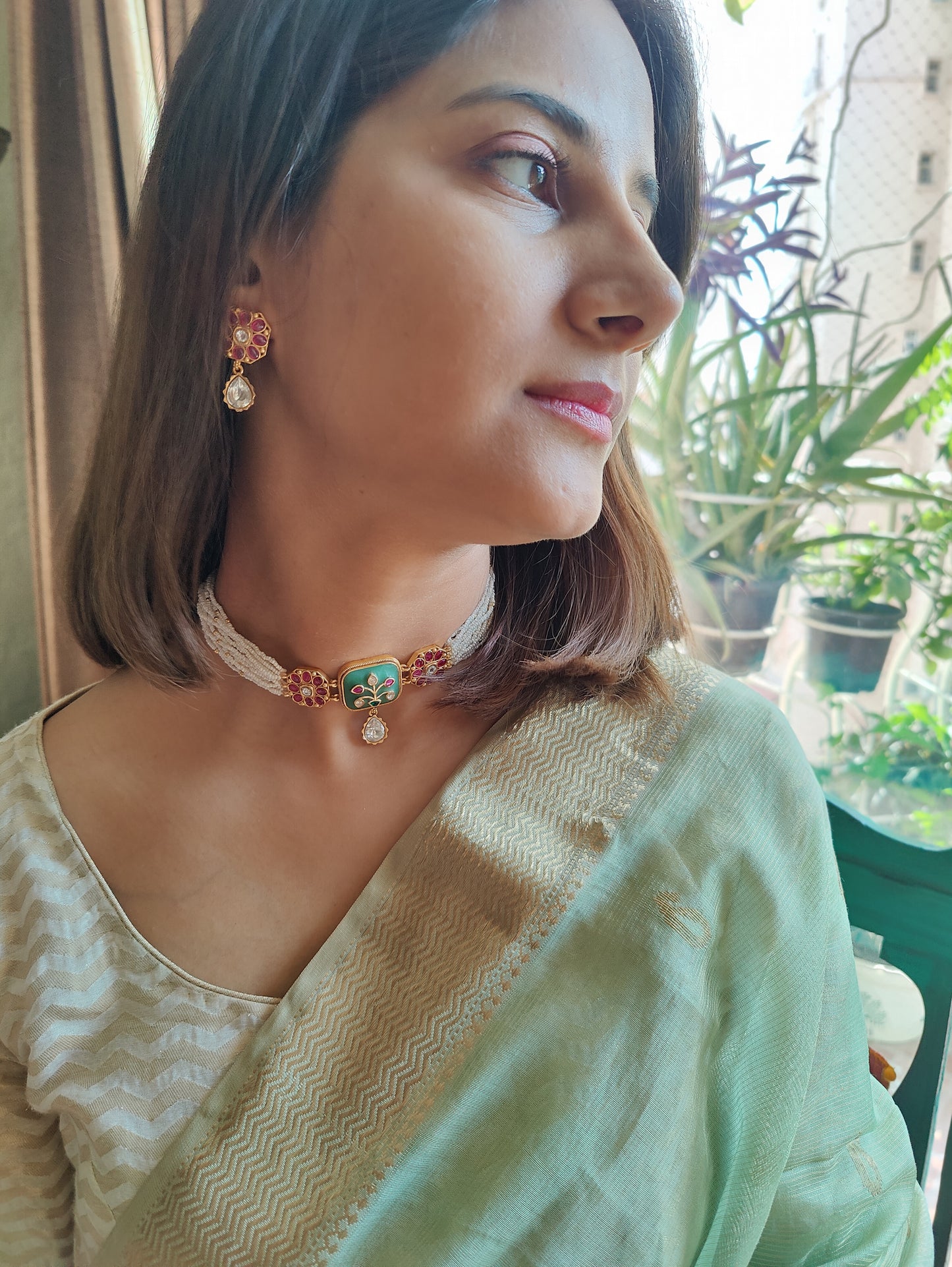 Dyanita choker set on poth pearl strings with mint green stones with work