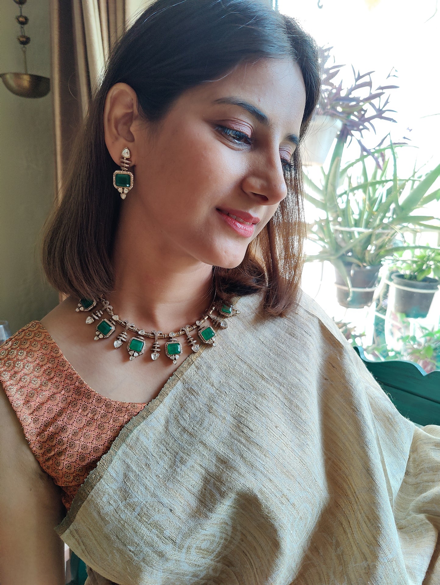 Bhavya necklace set with emerald stone and moissanite
