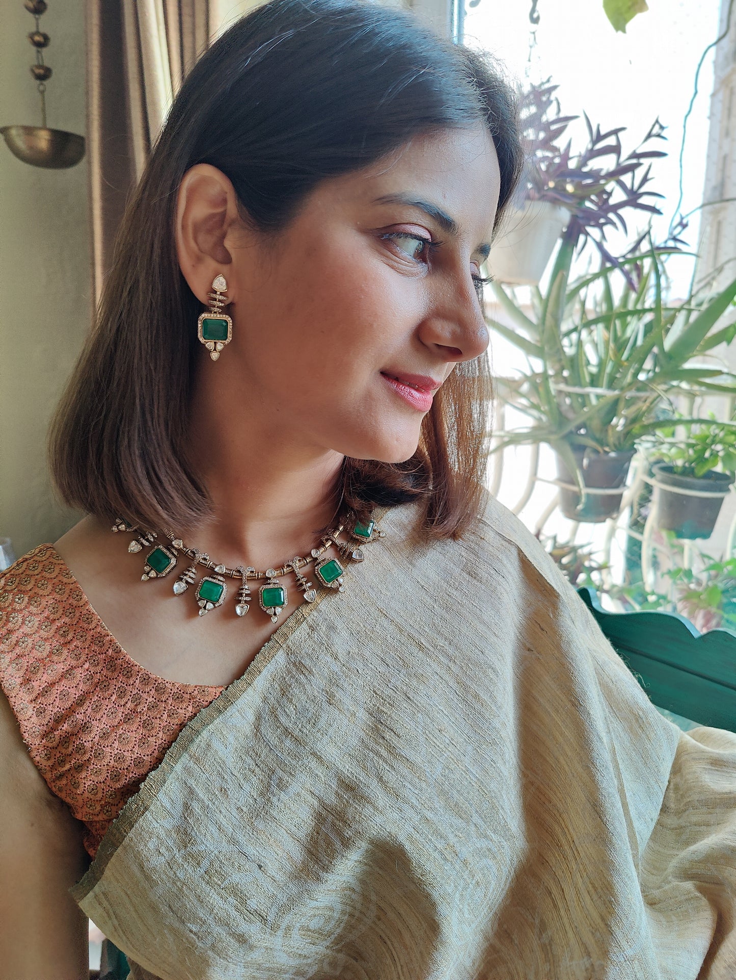Bhavya necklace set with emerald stone and moissanite