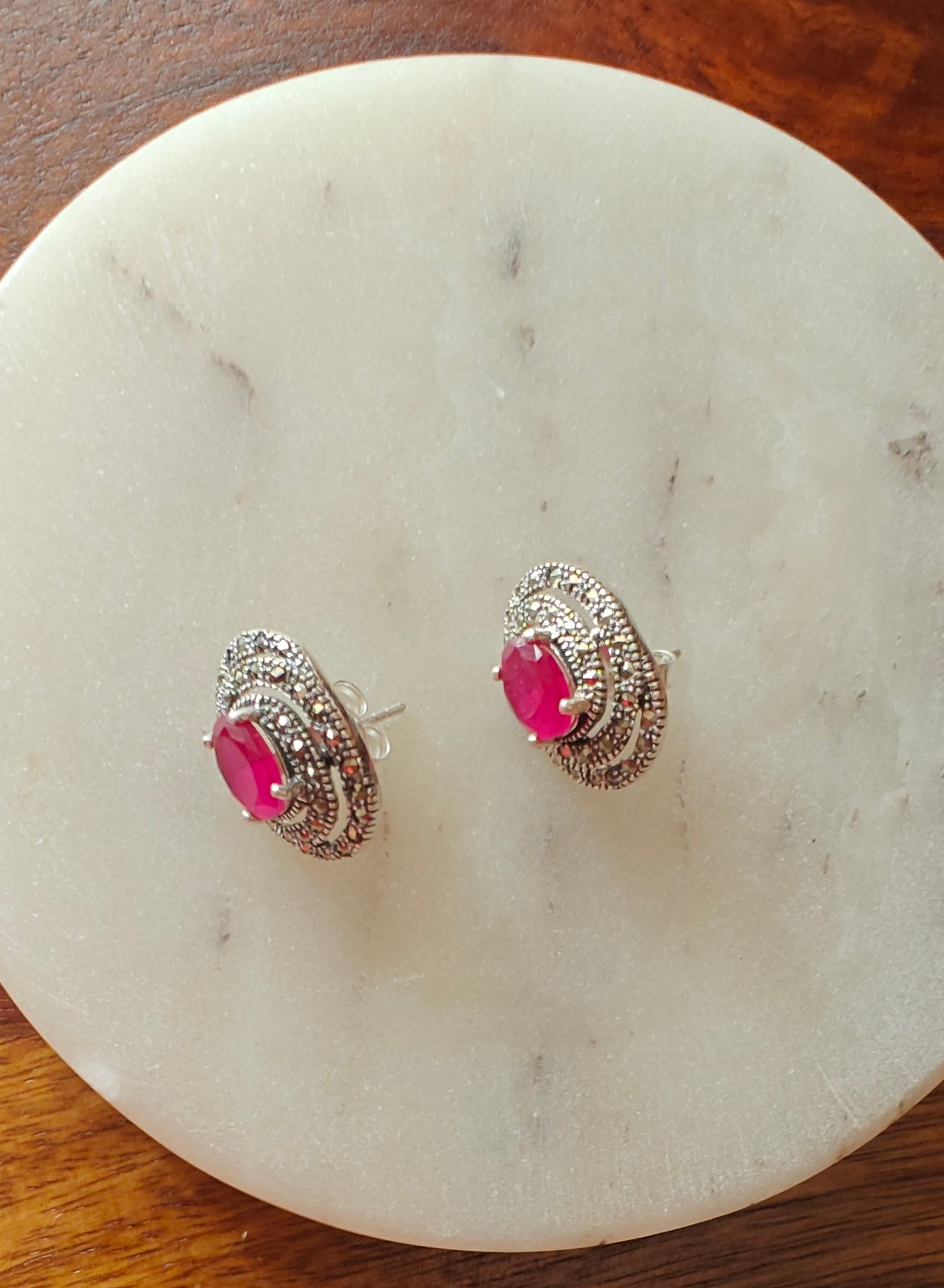 Radial silver studs(earrings) with emerald green/ ruby pink stone