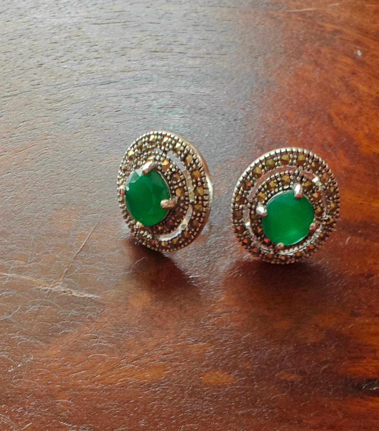 Radial silver studs(earrings) with emerald green/ ruby pink stone