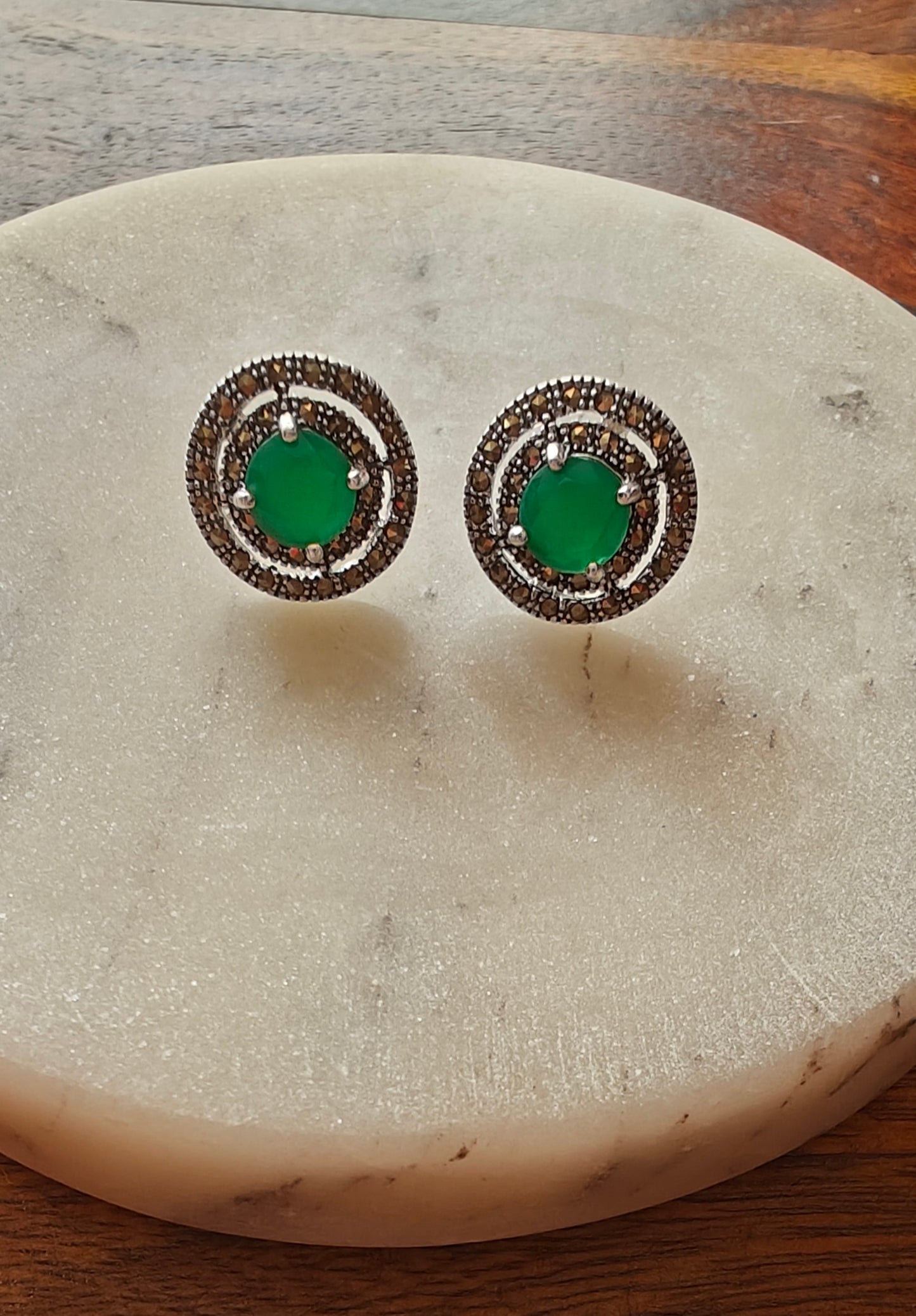Radial silver studs(earrings) with emerald green/ ruby pink stone