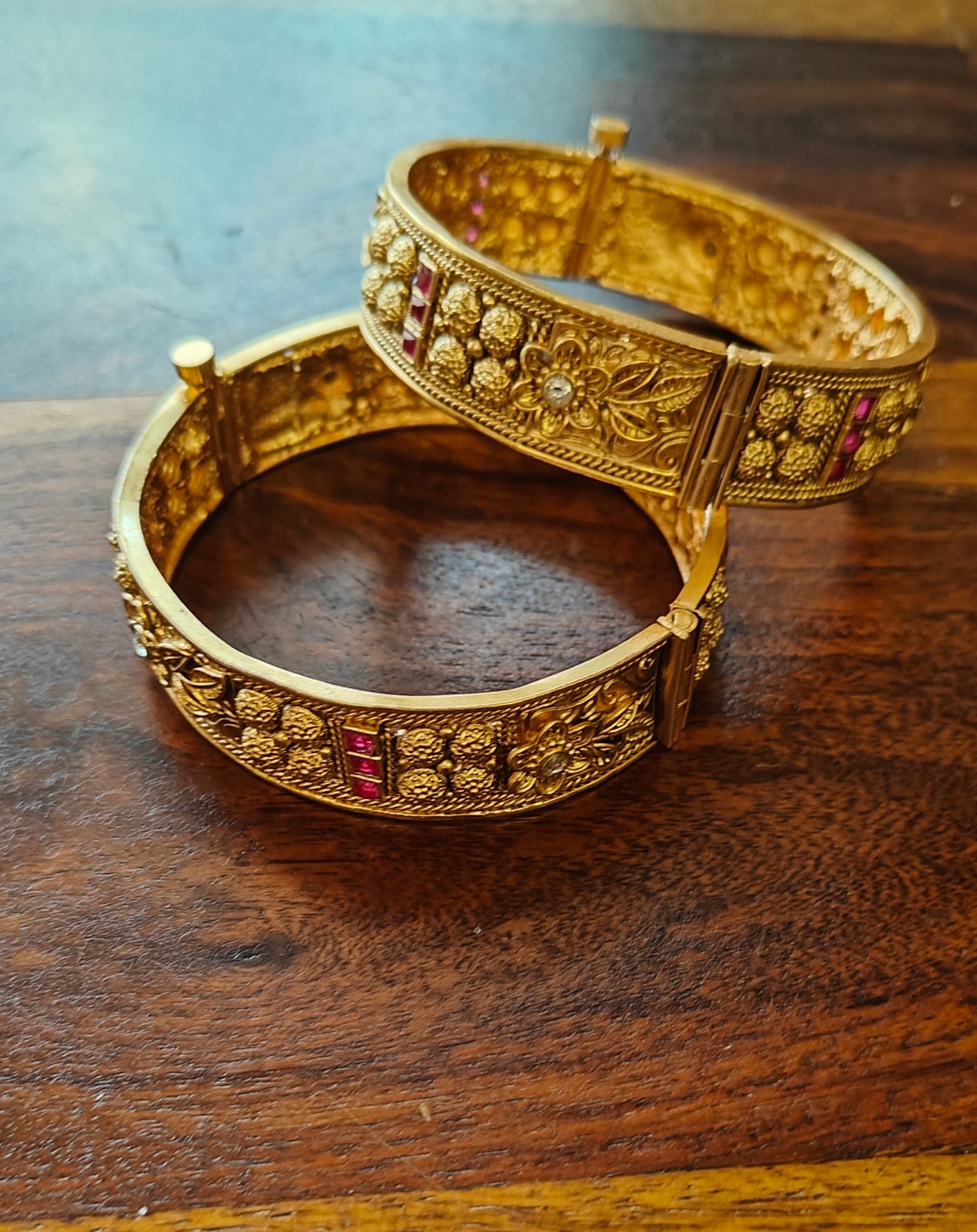 Golden karas with carved flowers and red stones(2pc)