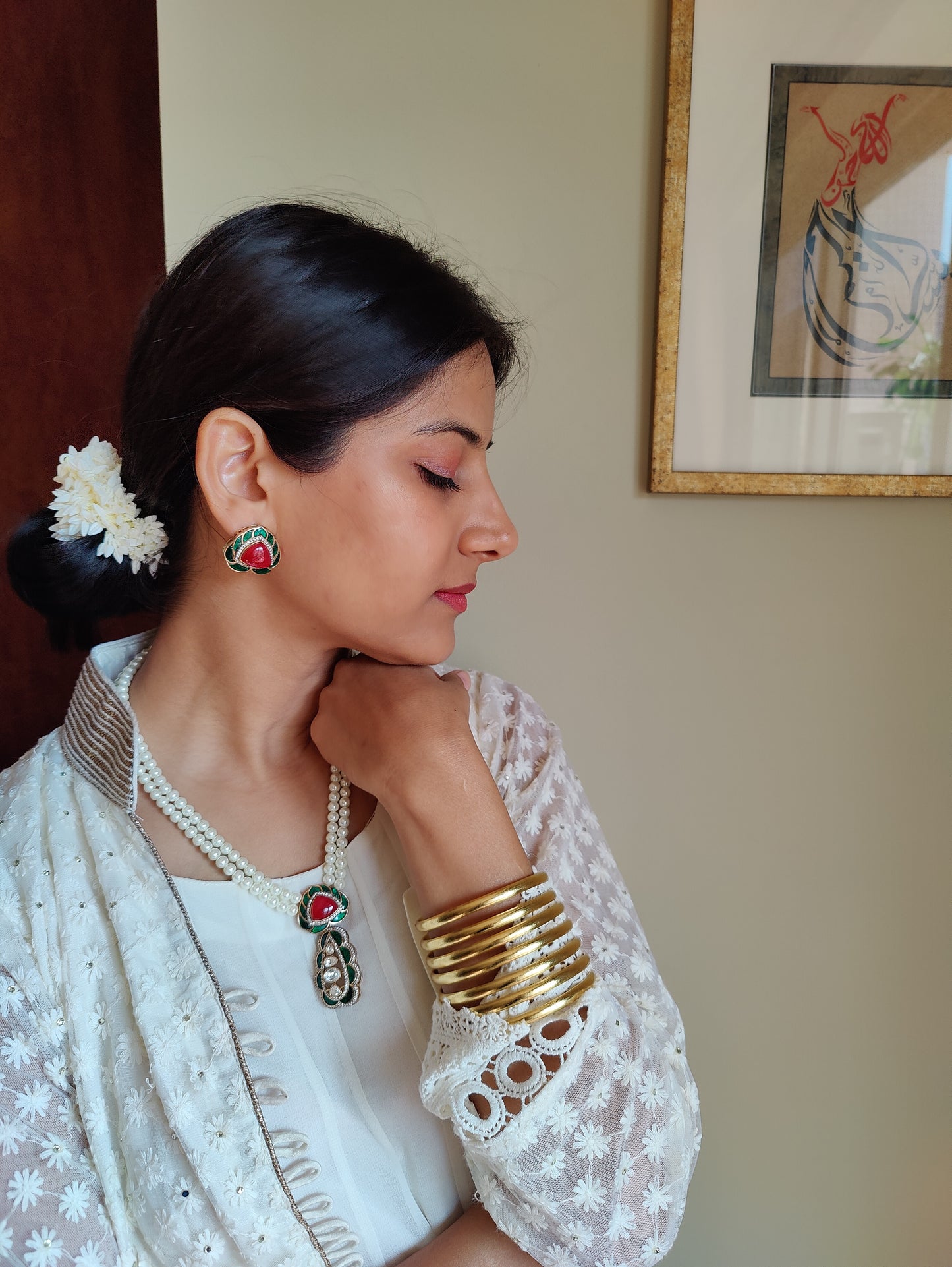 Bhanuja pearl strings set with kundan and stone