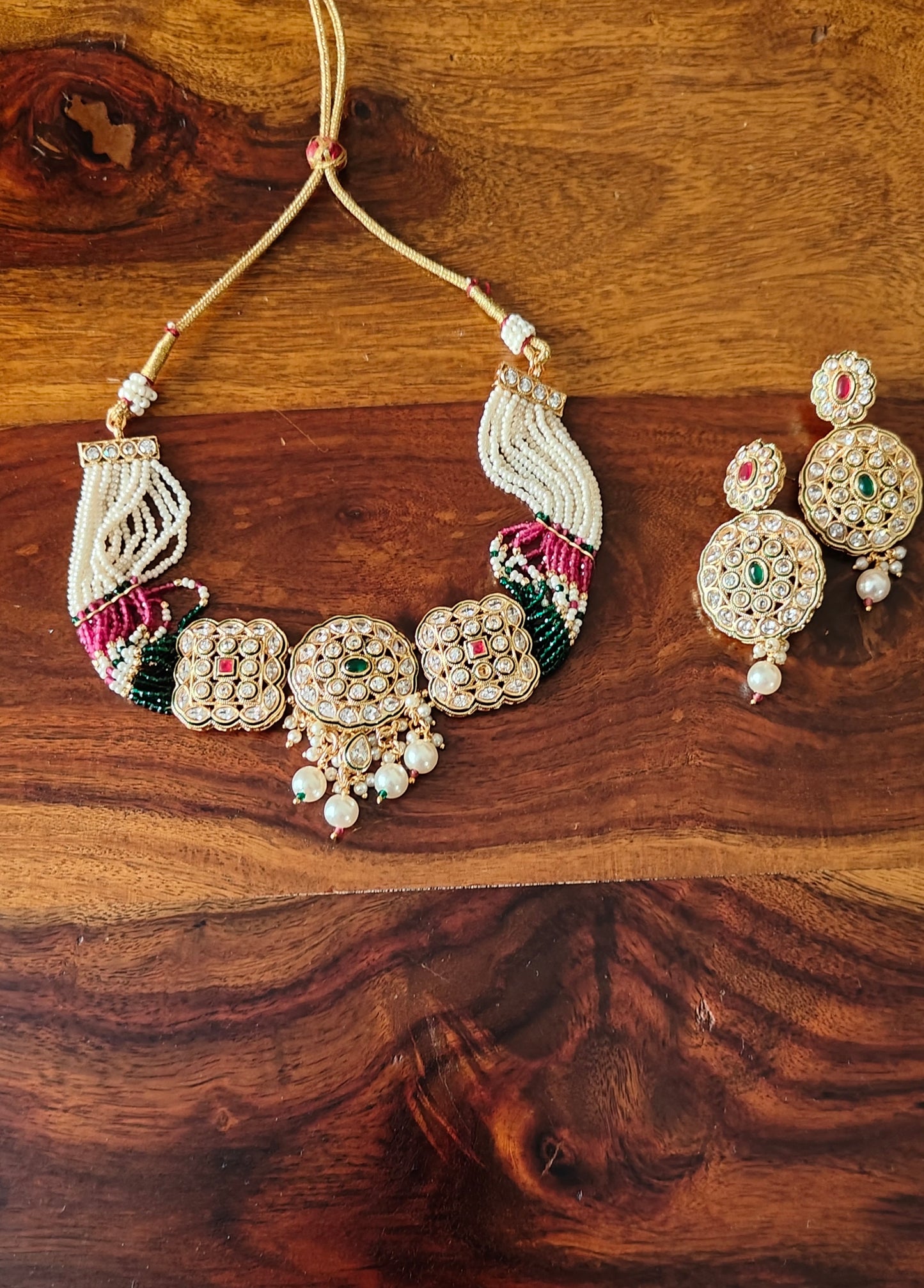 Marala choker with kundan studded pieces on poth pearl strings