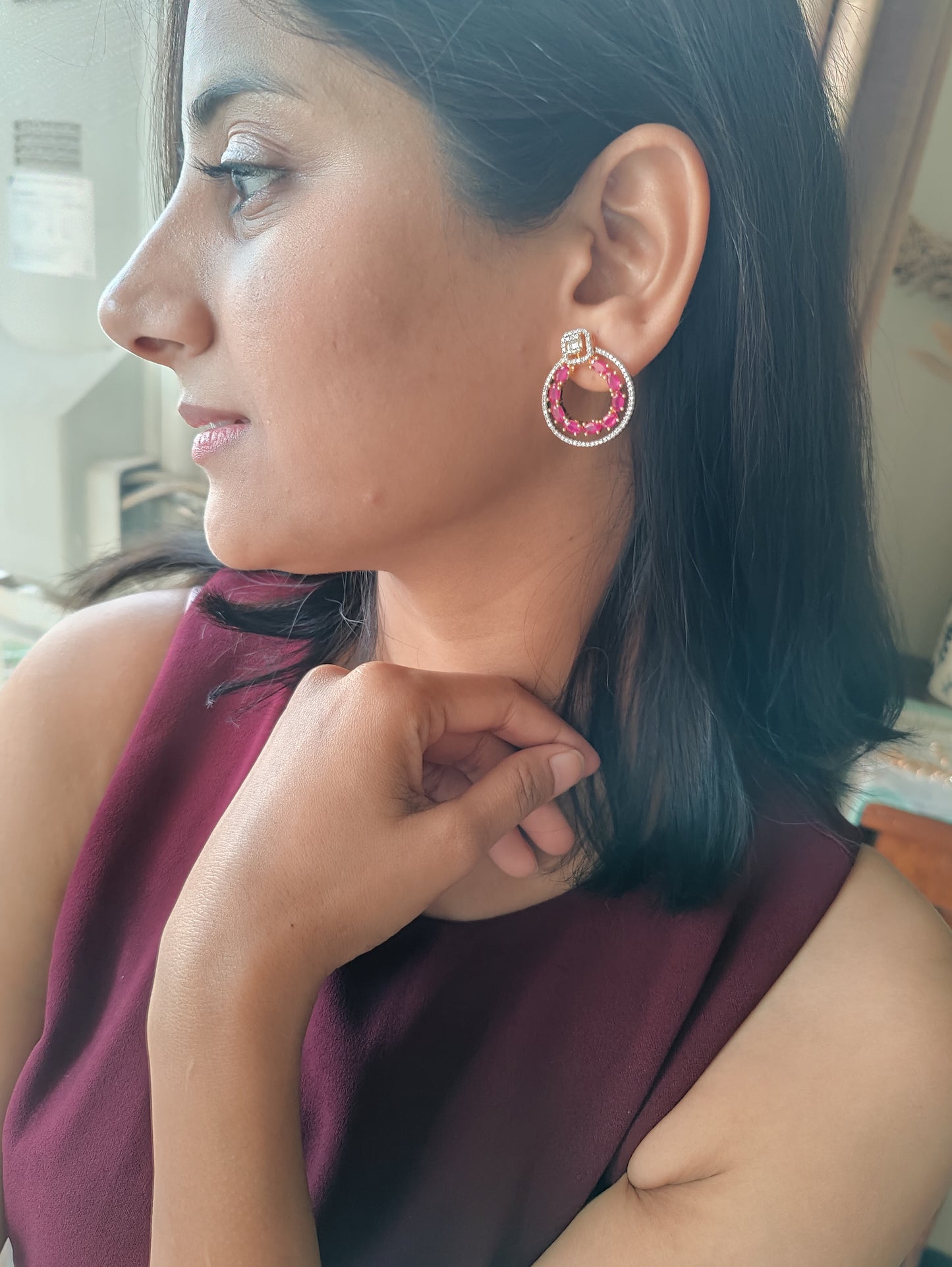 Ruby red/ emerald green circular earrings with Cz highlights