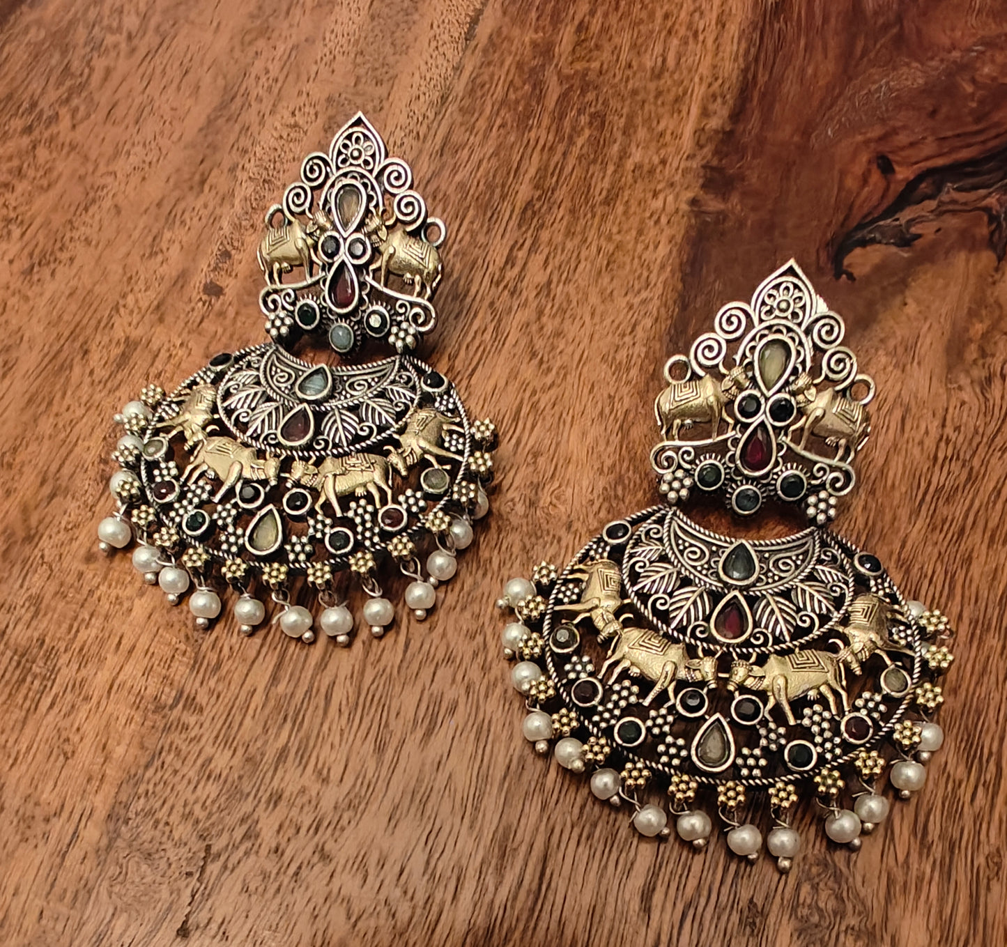 Dual tone earrings with cow motif