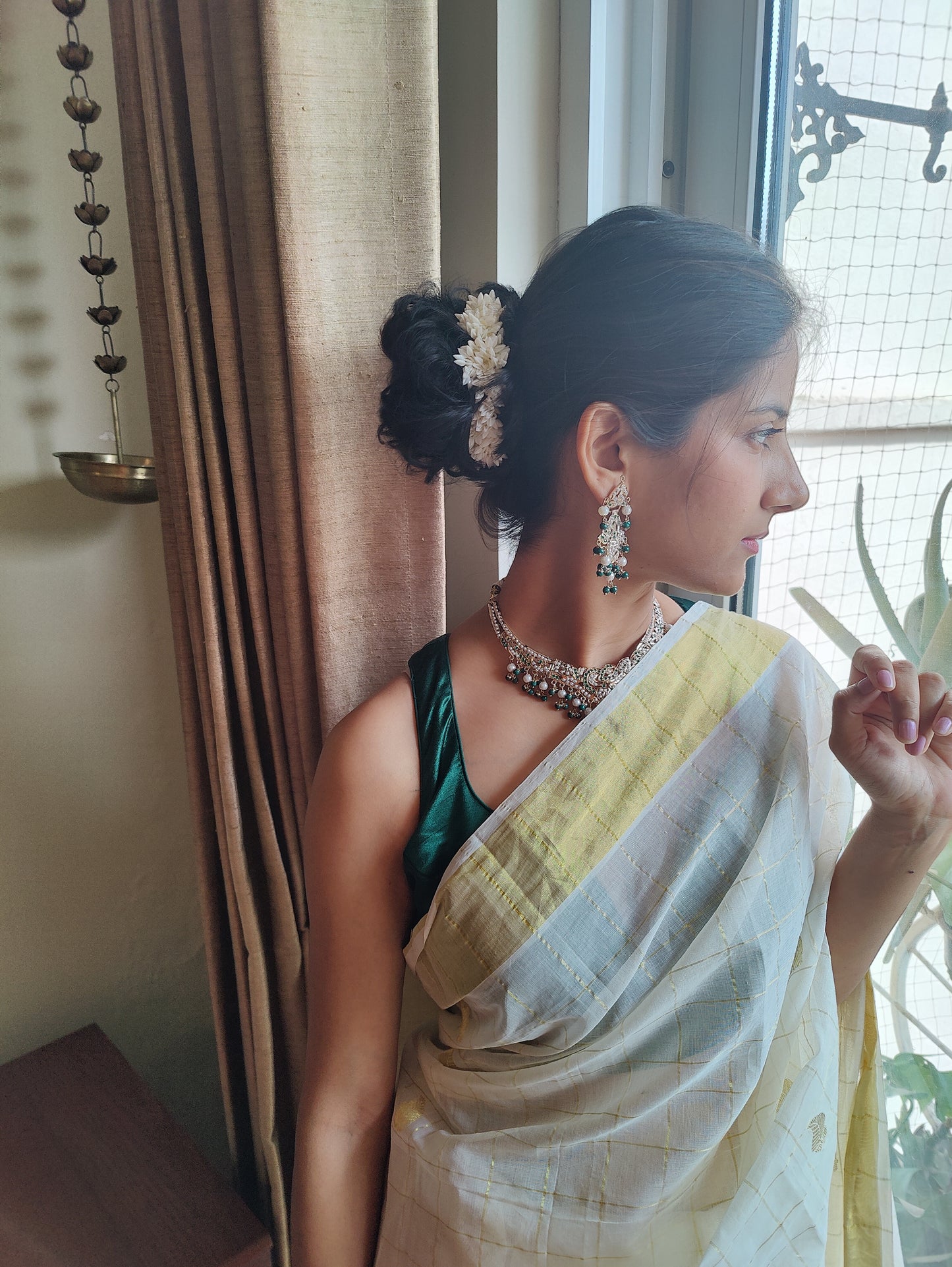 Abja jadau set with emerald green stones and pearls
