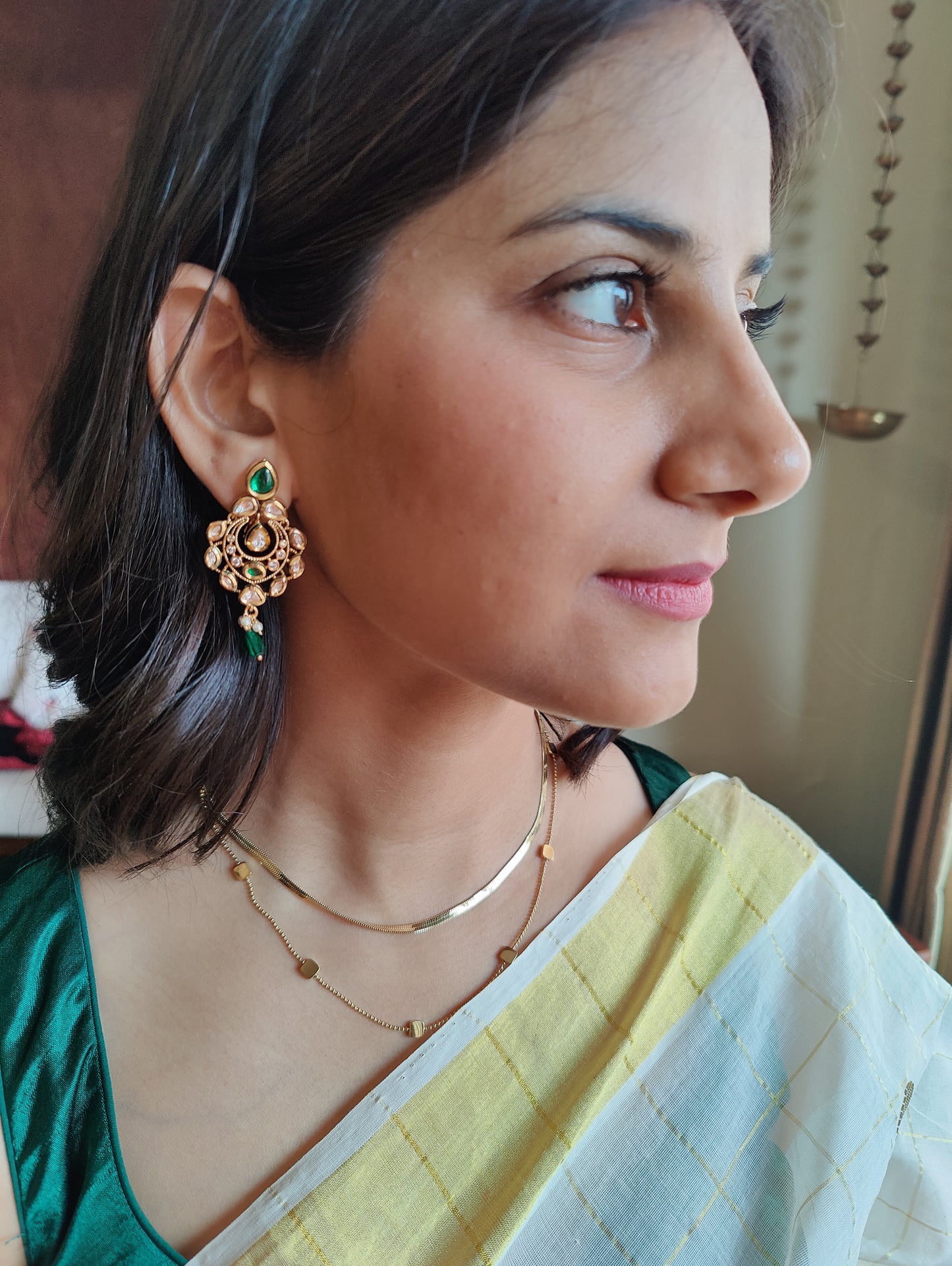 Chhabi earrings with kundan and emerald green stone