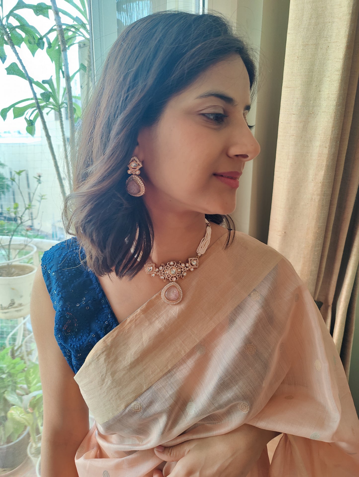 Nirupa choker set with stone and moissanite on poth pearl strings
