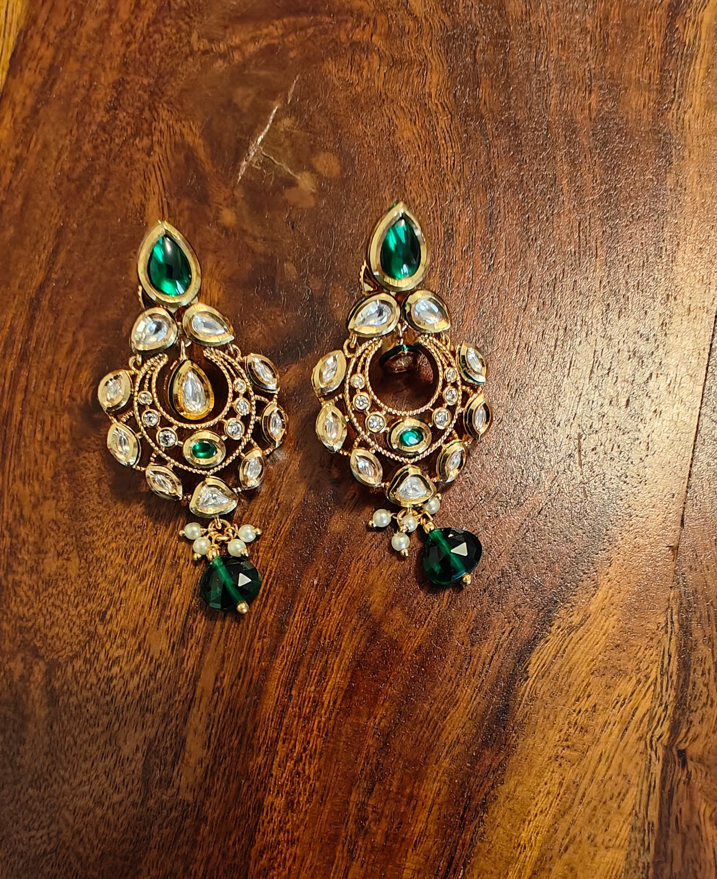 Chhabi earrings with kundan and emerald green stone