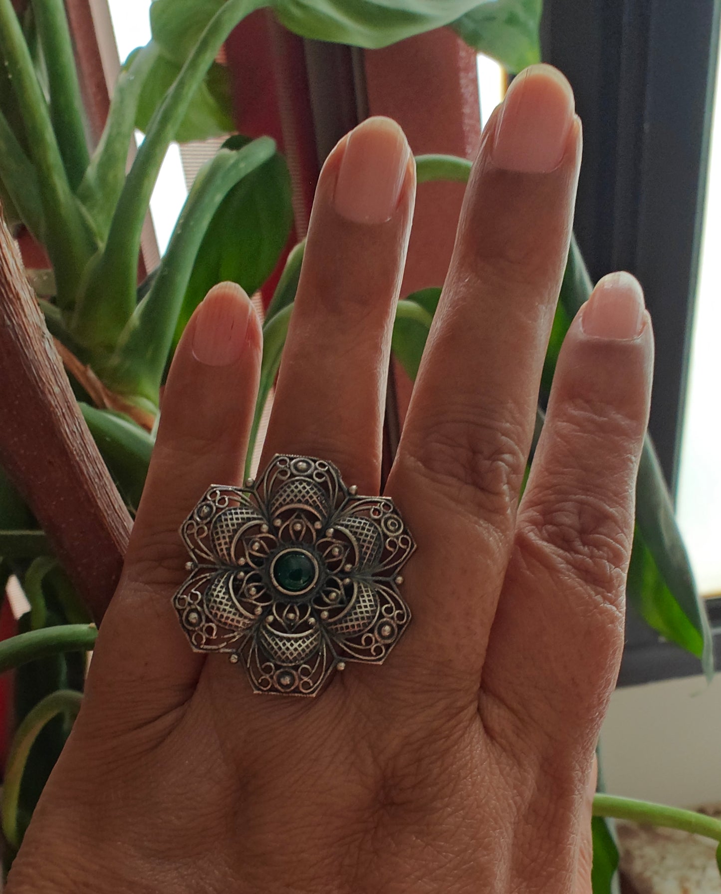 Sterling silver flower ring with green emerald stone