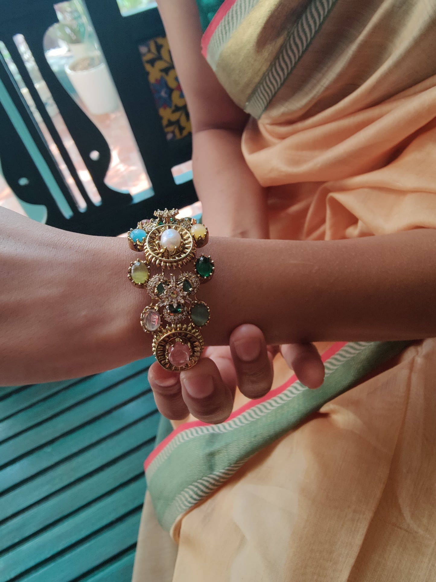 Stone studded kara( bangle) with pearl and different stones