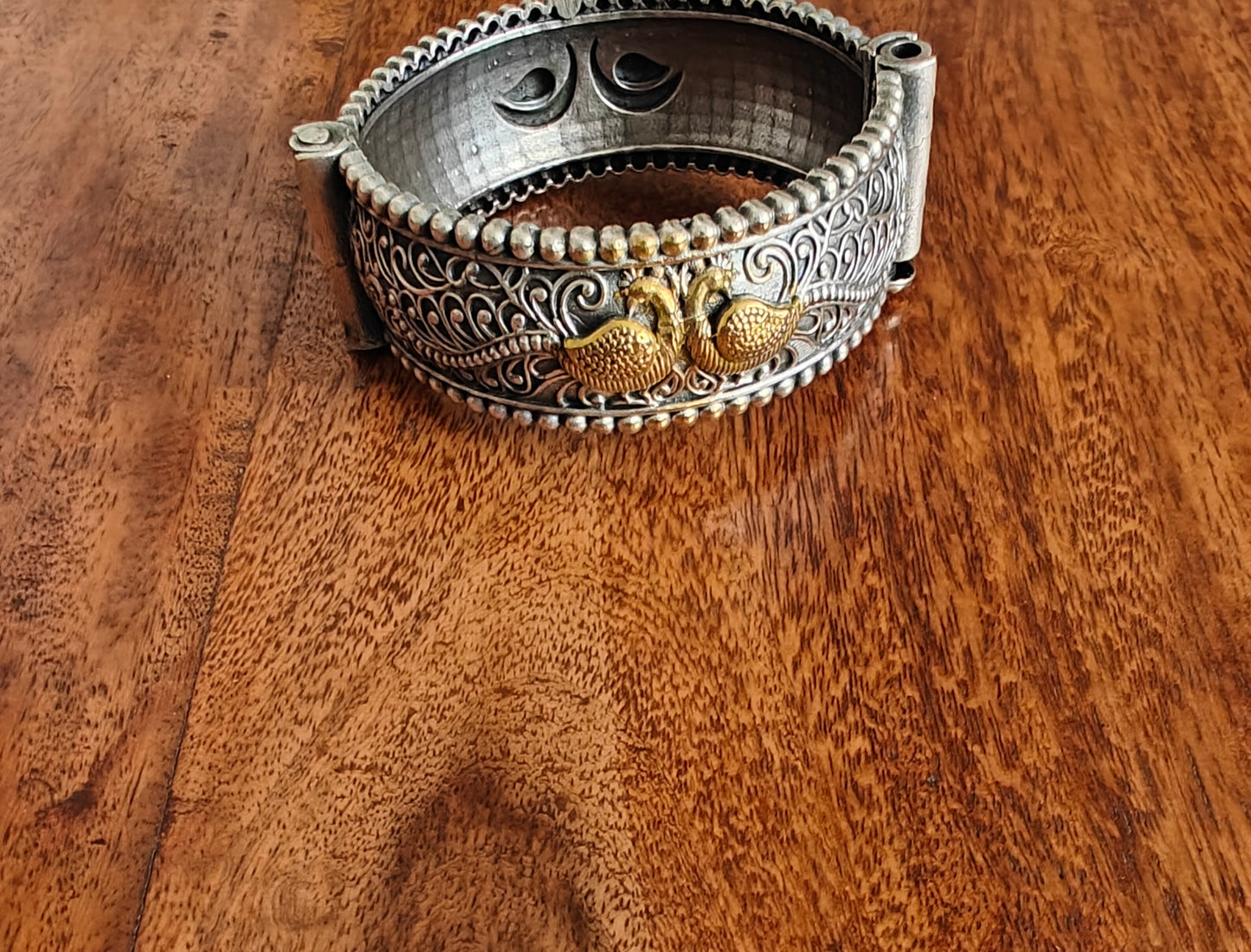 Dual tone kara with peacock engraving
