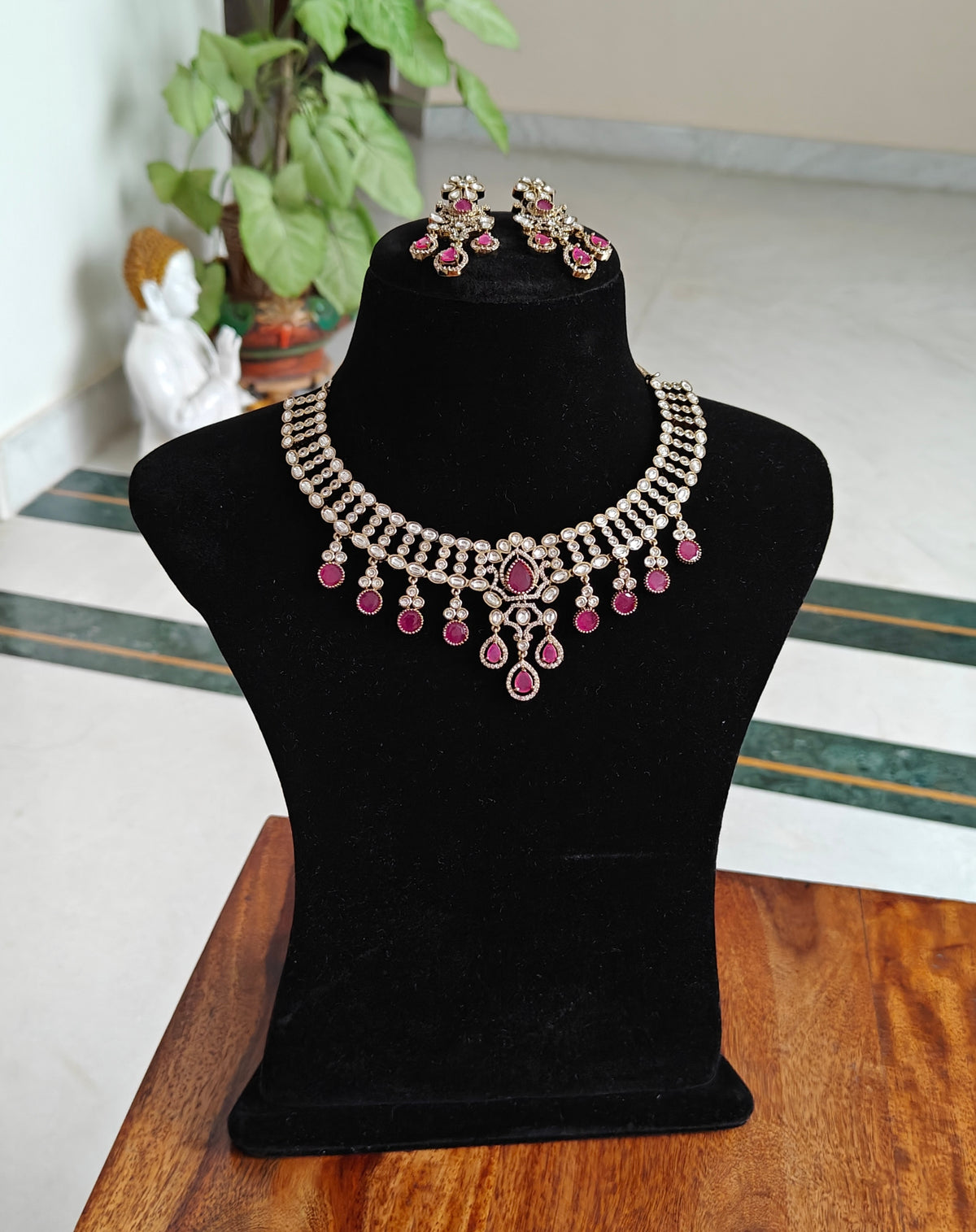 Tapani set with moissanite pieces on neck piece and stones hanging below