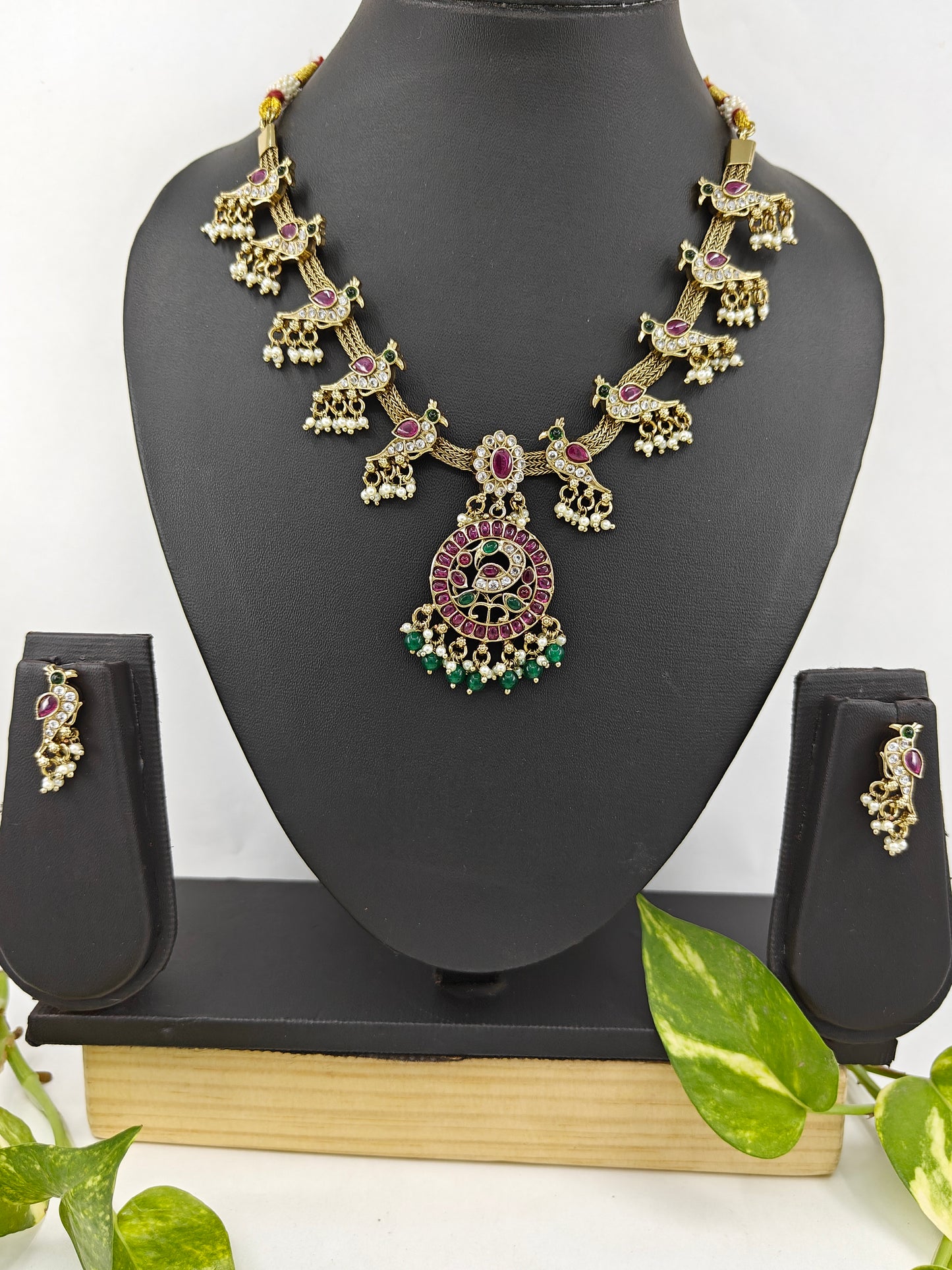 'Parindey' set with stone studded birds perched on a woven flat chain necklace