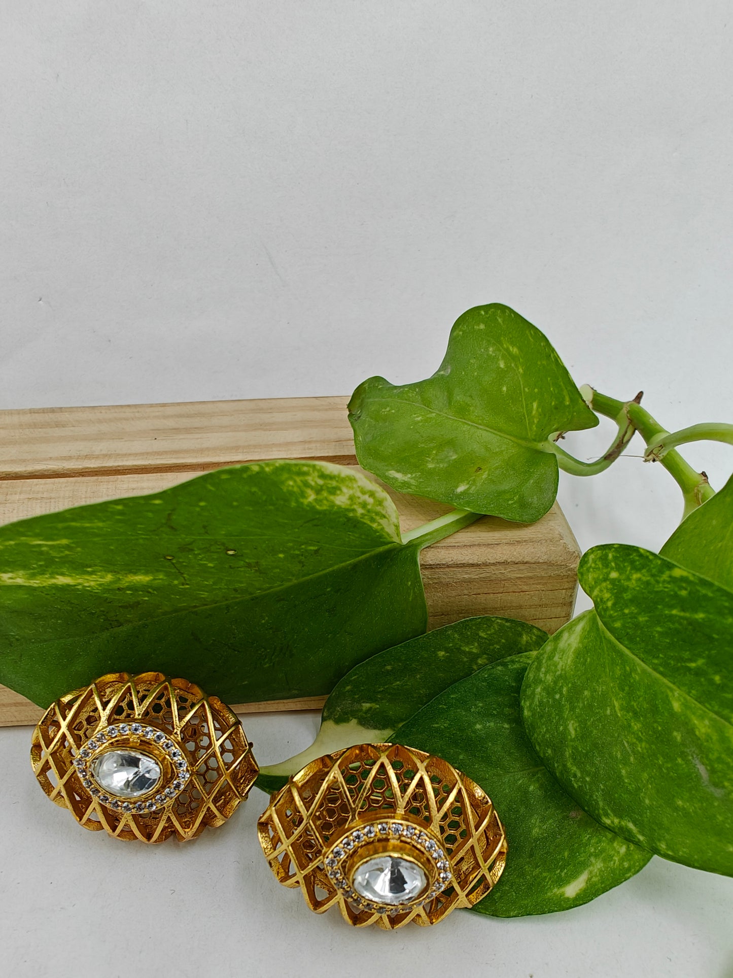 Web of gold kundan studs
