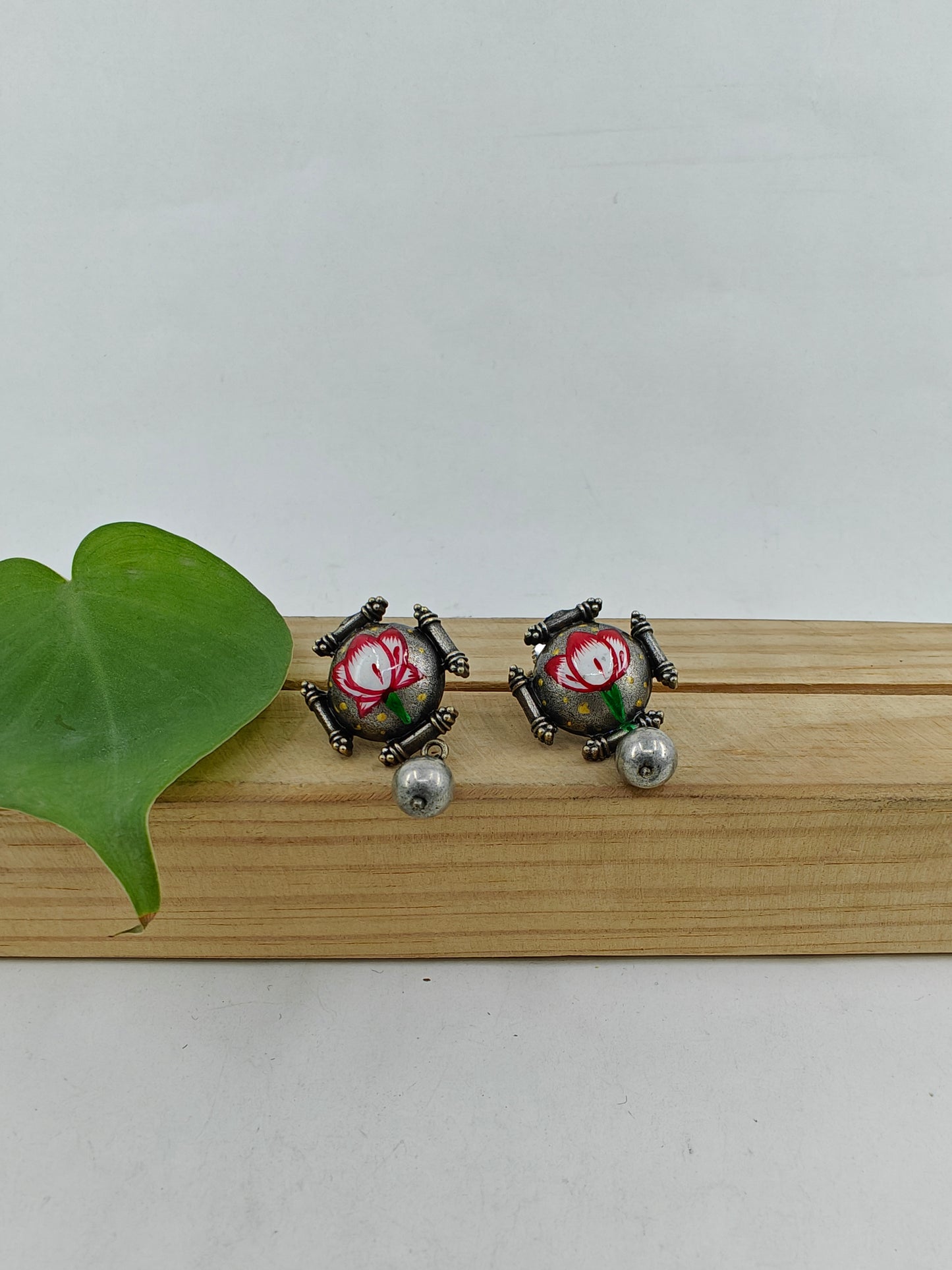 Dual tone set with painted Lotus on dome shaped pieces and peacock pendant with chattai work