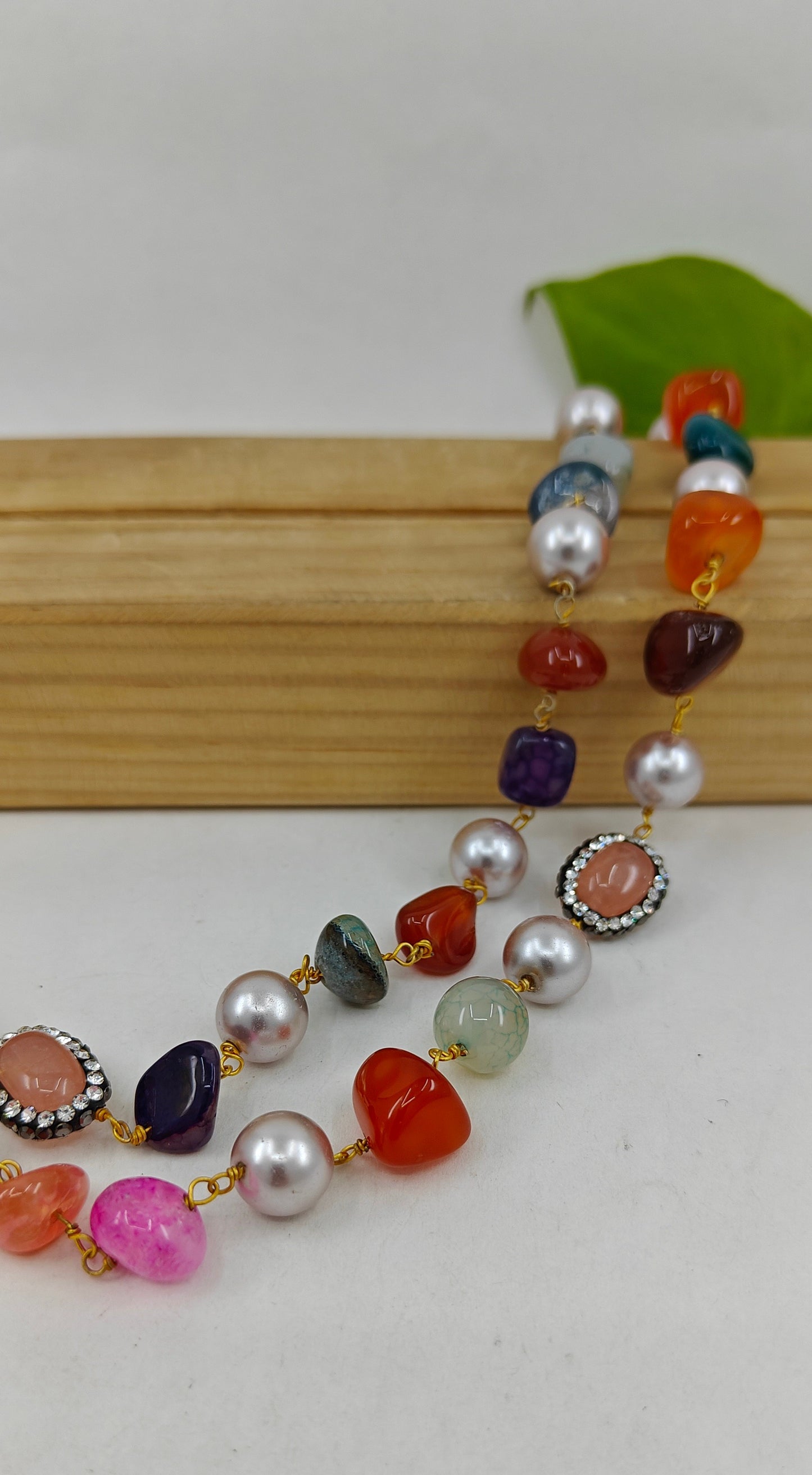 Set with a double string necklace with pearls,stone with CZ,multicolour stones