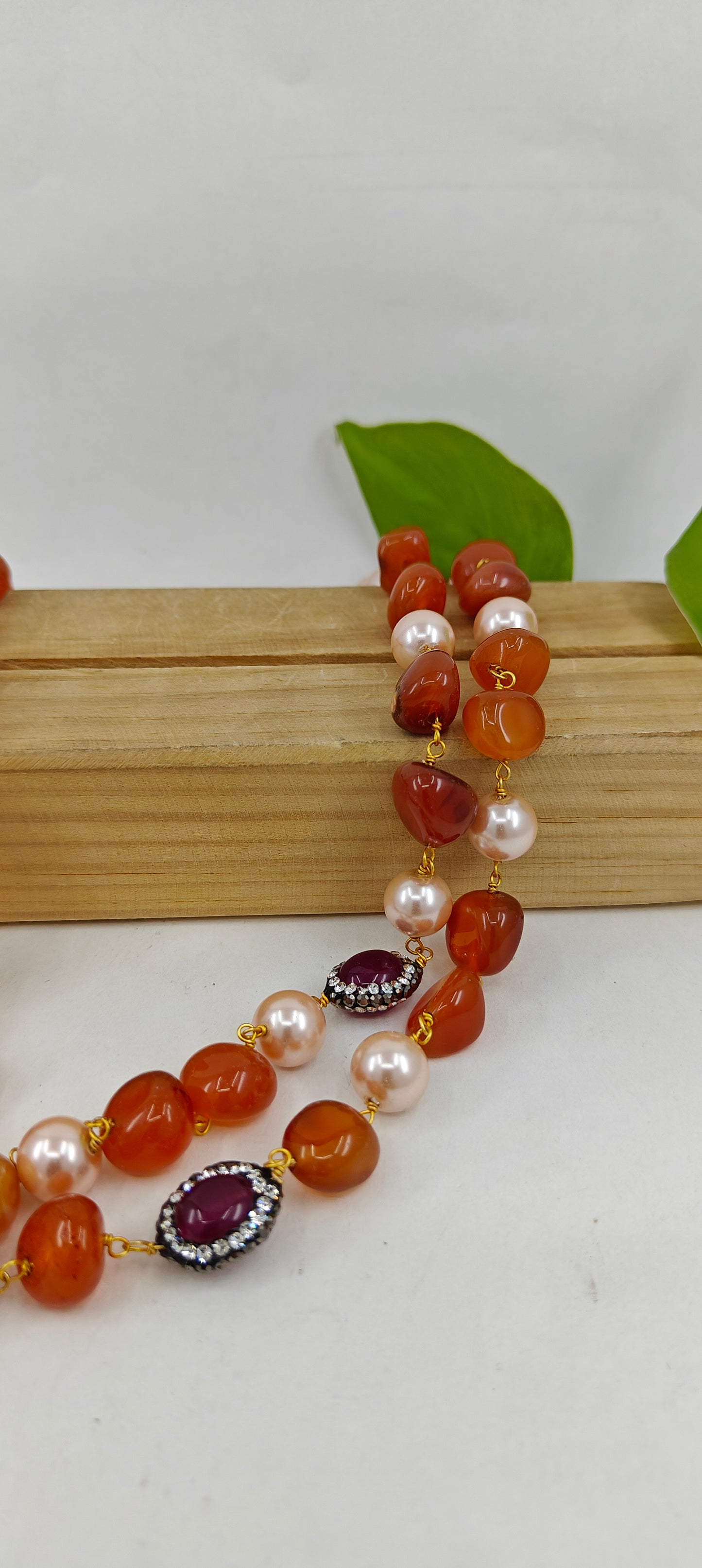 Set with a double string necklace with pearls,stone with CZ,multicolour stones