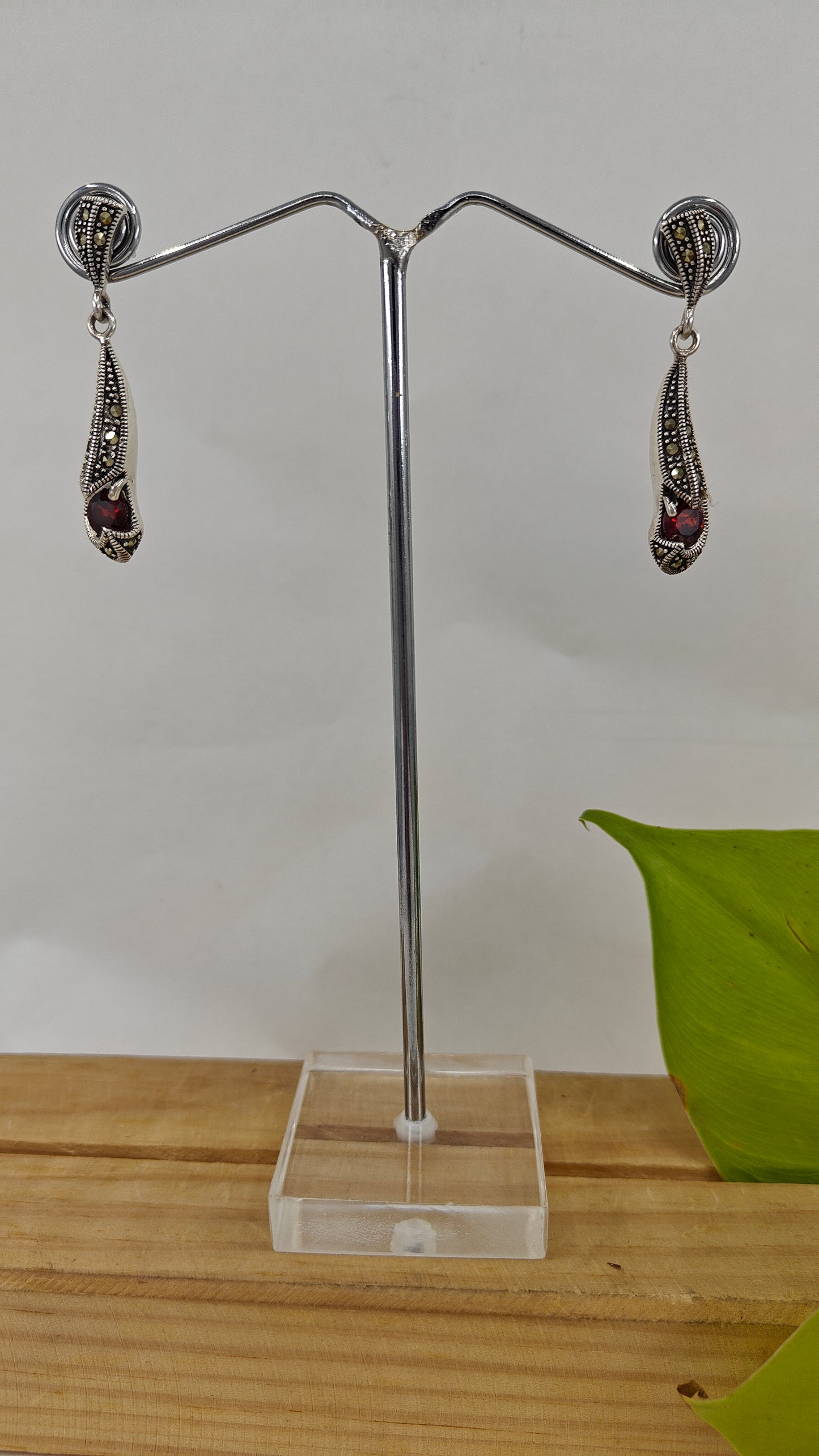 Matsya elegant silver earrings with ruby red stone