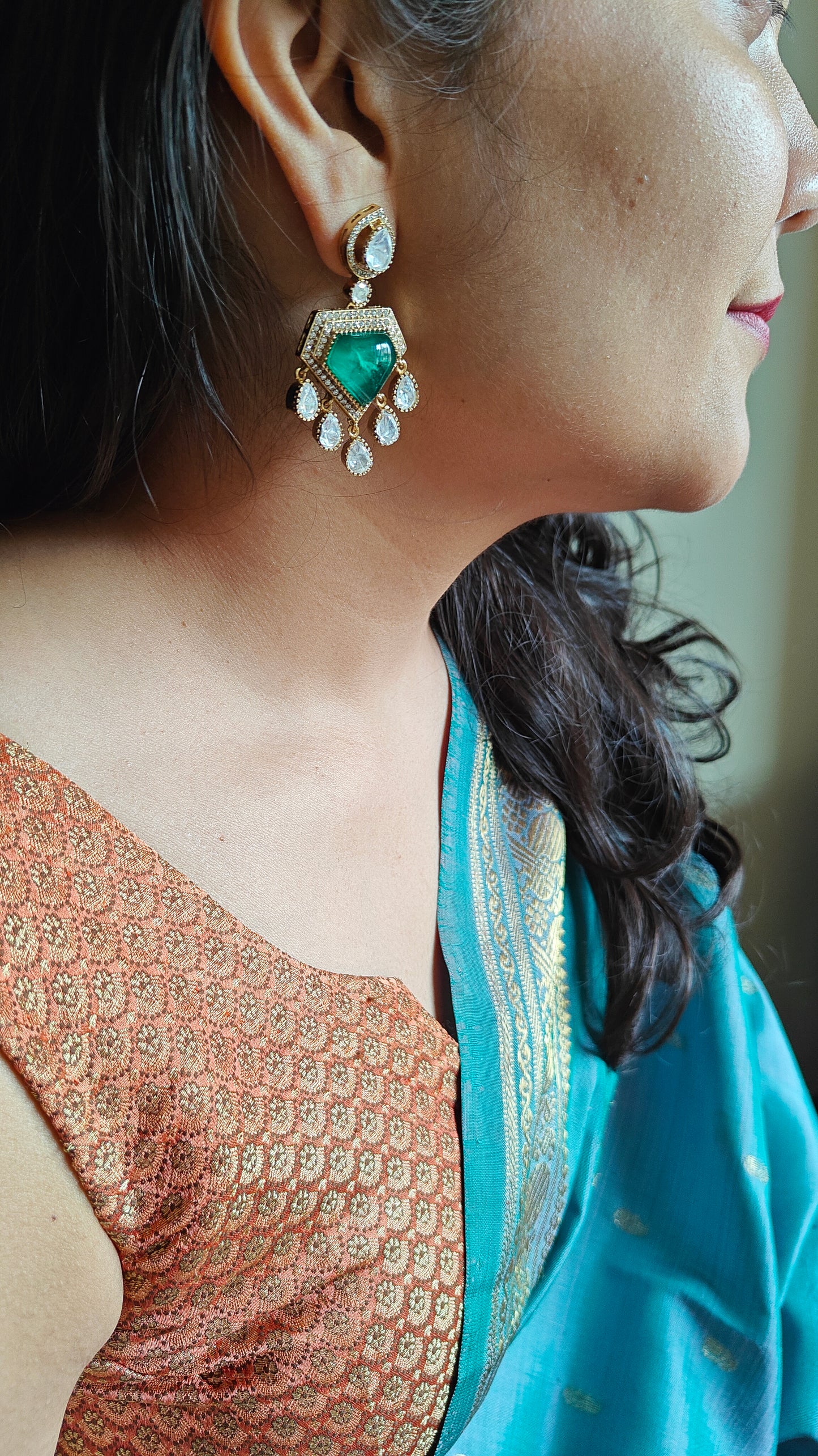 Nitya earrings with emerald green stone and moissanite