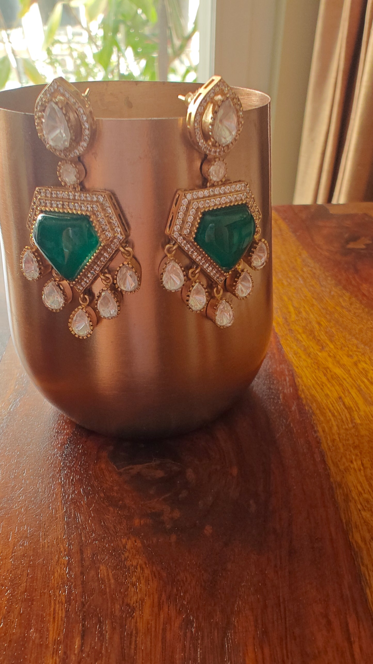 Nitya earrings with emerald green stone and moissanite