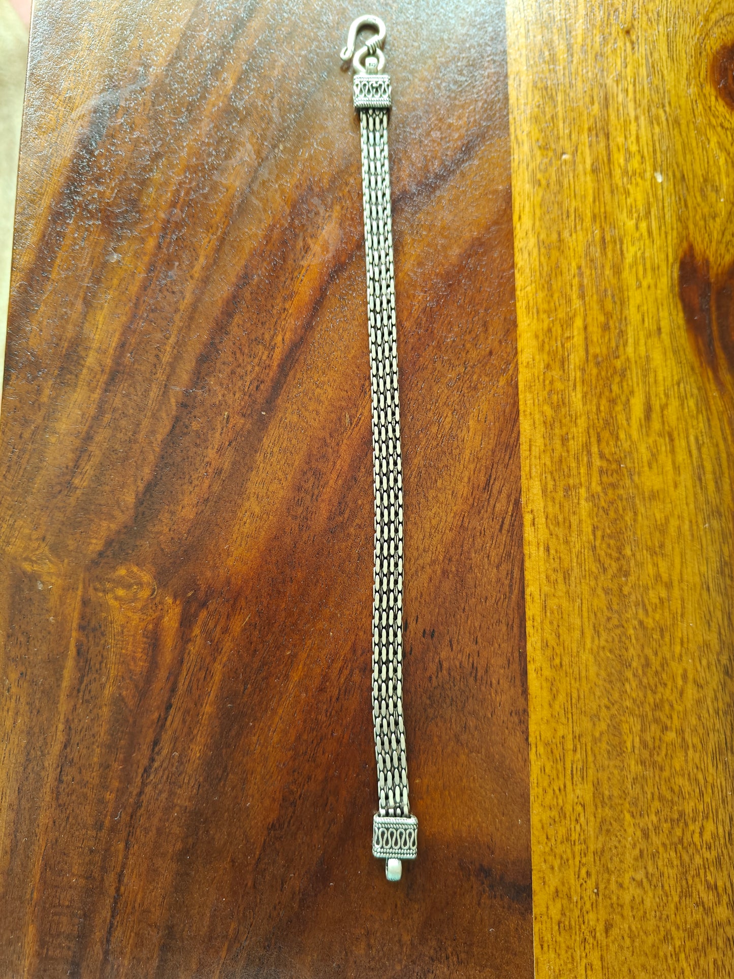 Faria silver bracelet with strap design