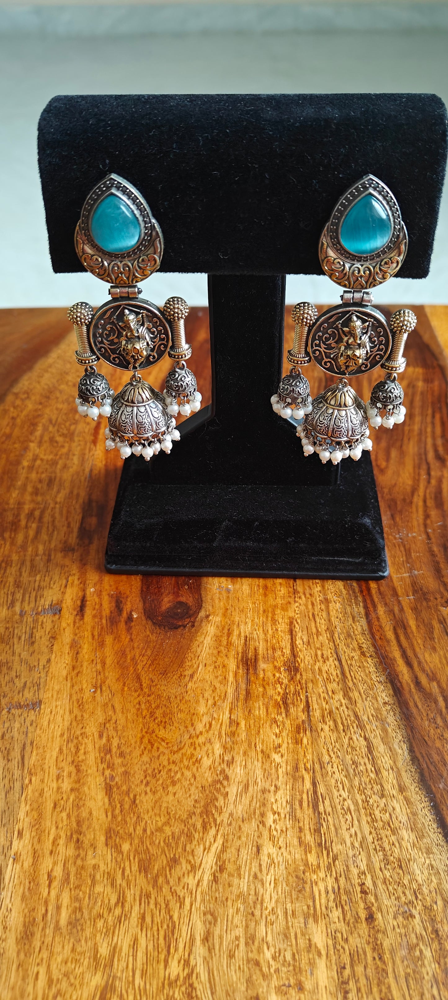 Dual tone multiple jhumkis with Ganesha