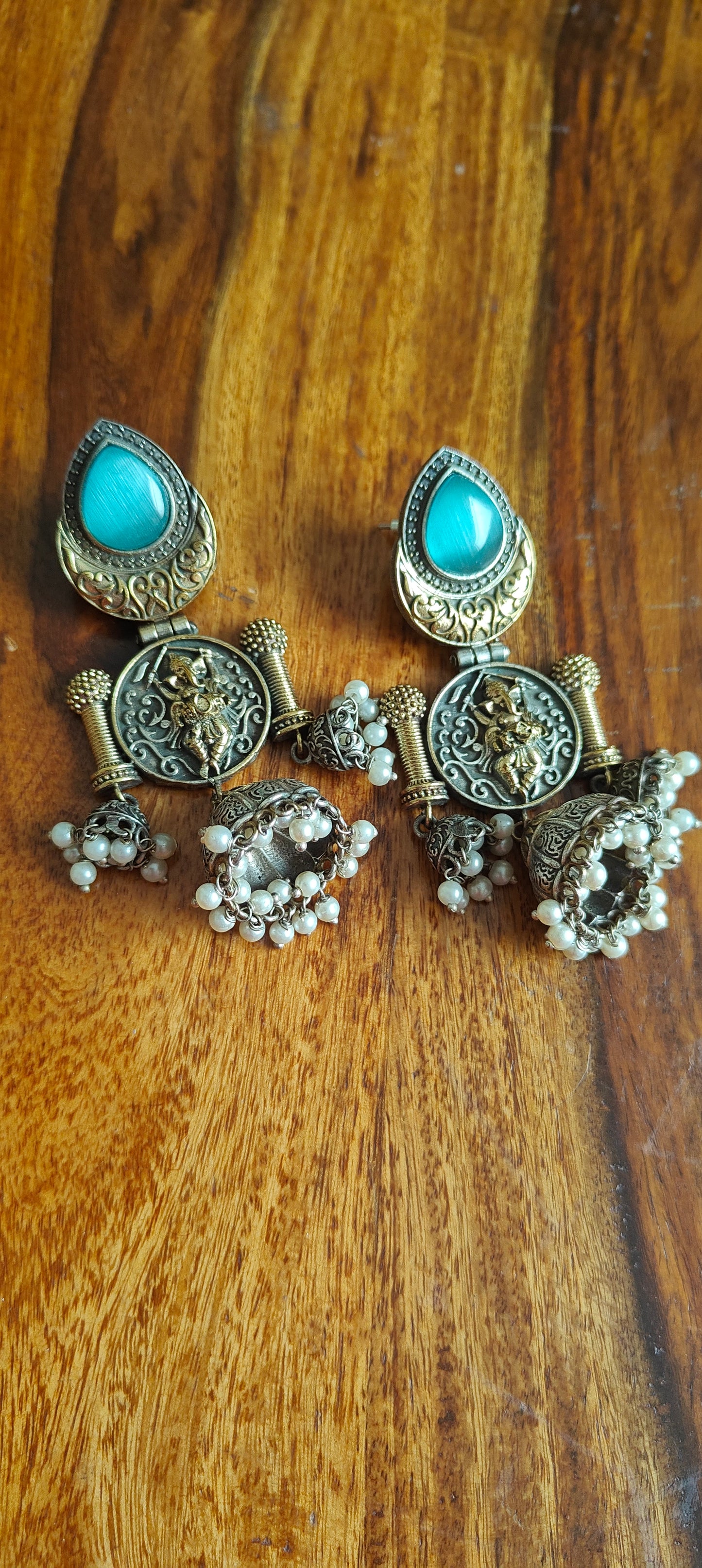 Dual tone multiple jhumkis with Ganesha