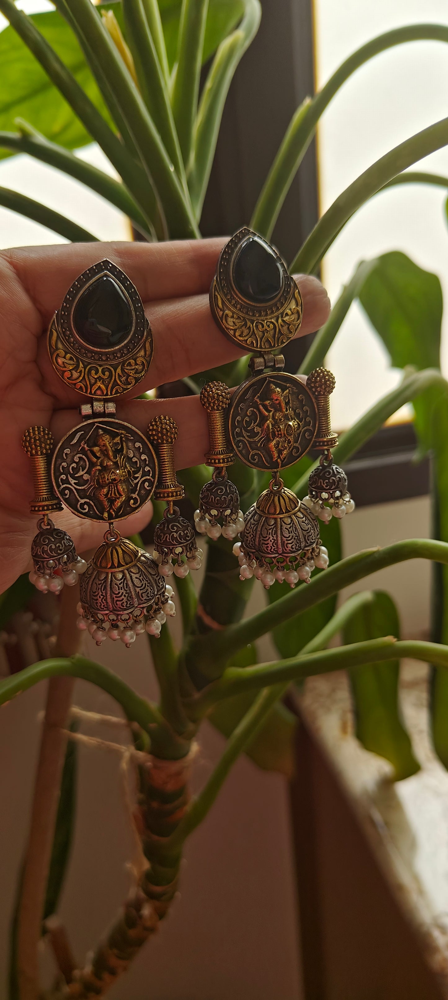 Dual tone multiple jhumkis with Ganesha