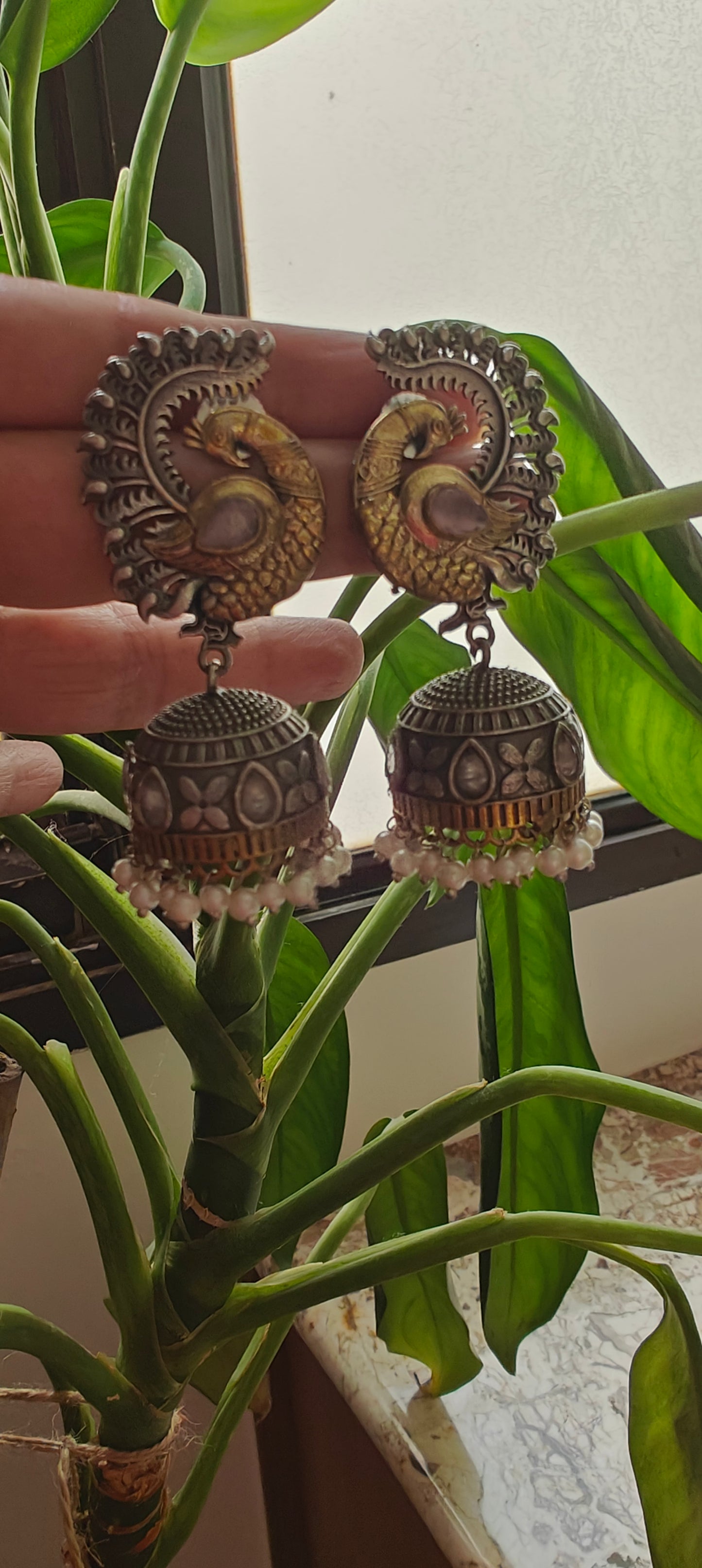 Dual tone peacock jhumkas with stone