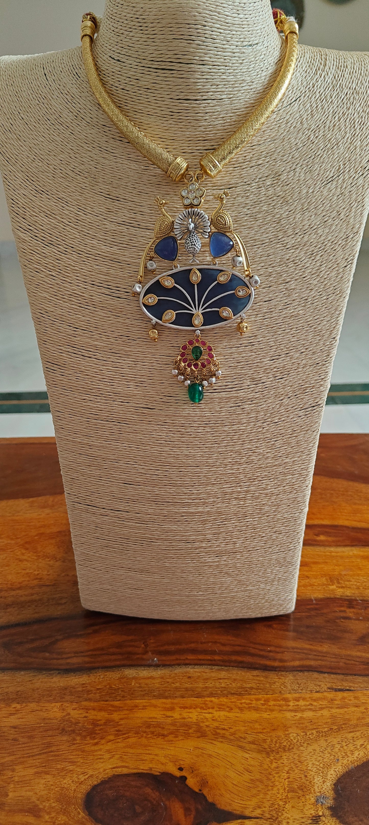 Hasli set in dual tone, pearched peacocks on stone pendant with Kundan work, matching earrings