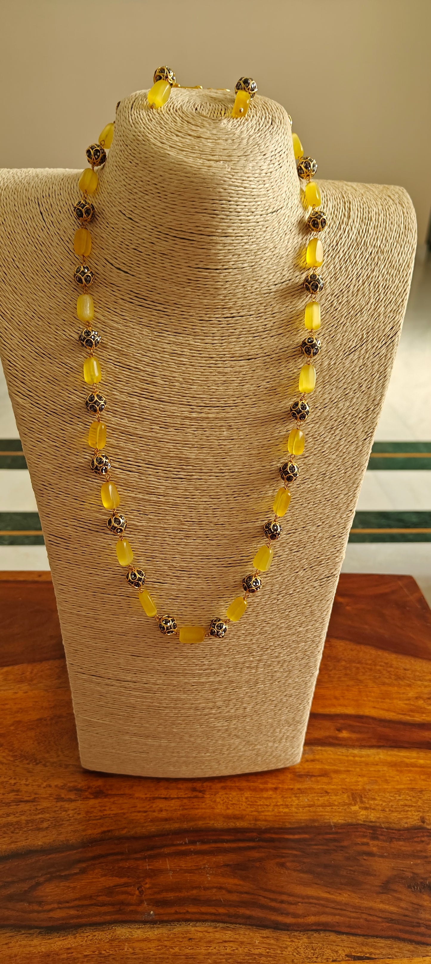 Bead set with rectangular stones and metal beads