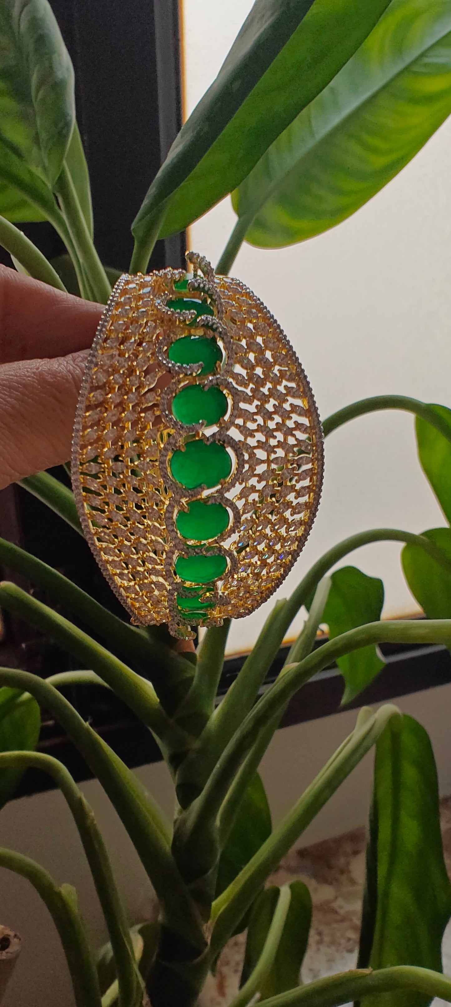 Emerald stone golden jali kara( bangle) with emerald colour stone
