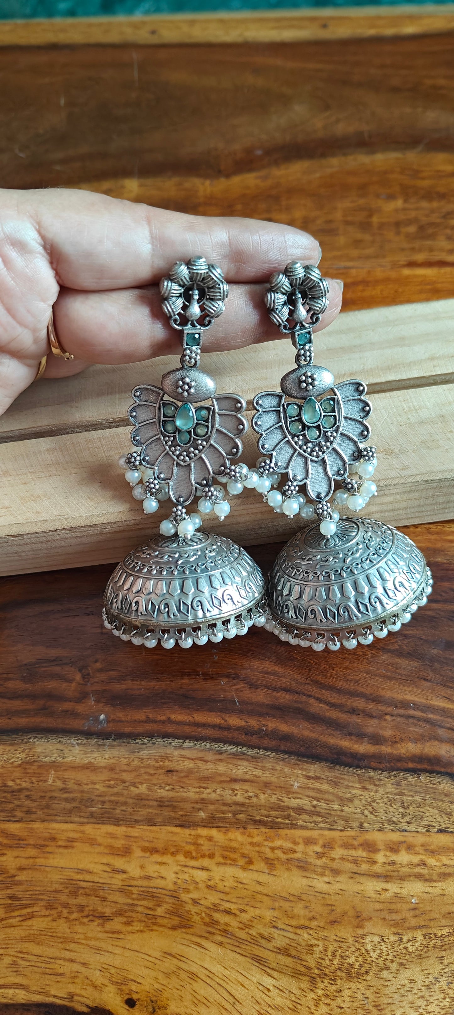 Big Jhumkis with peacock studs and blue stones,pearls