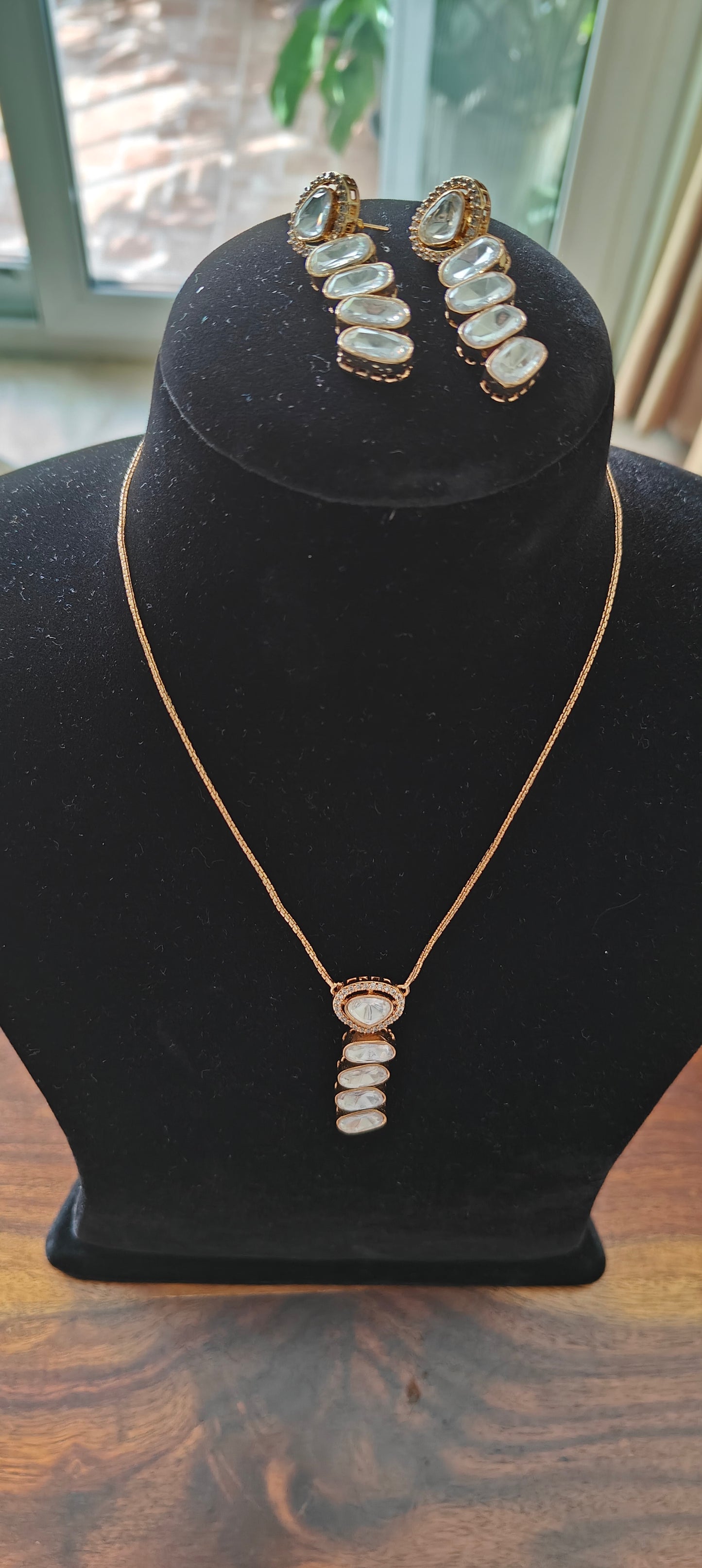 Deeptikana set with layered kundan pendant and earrings