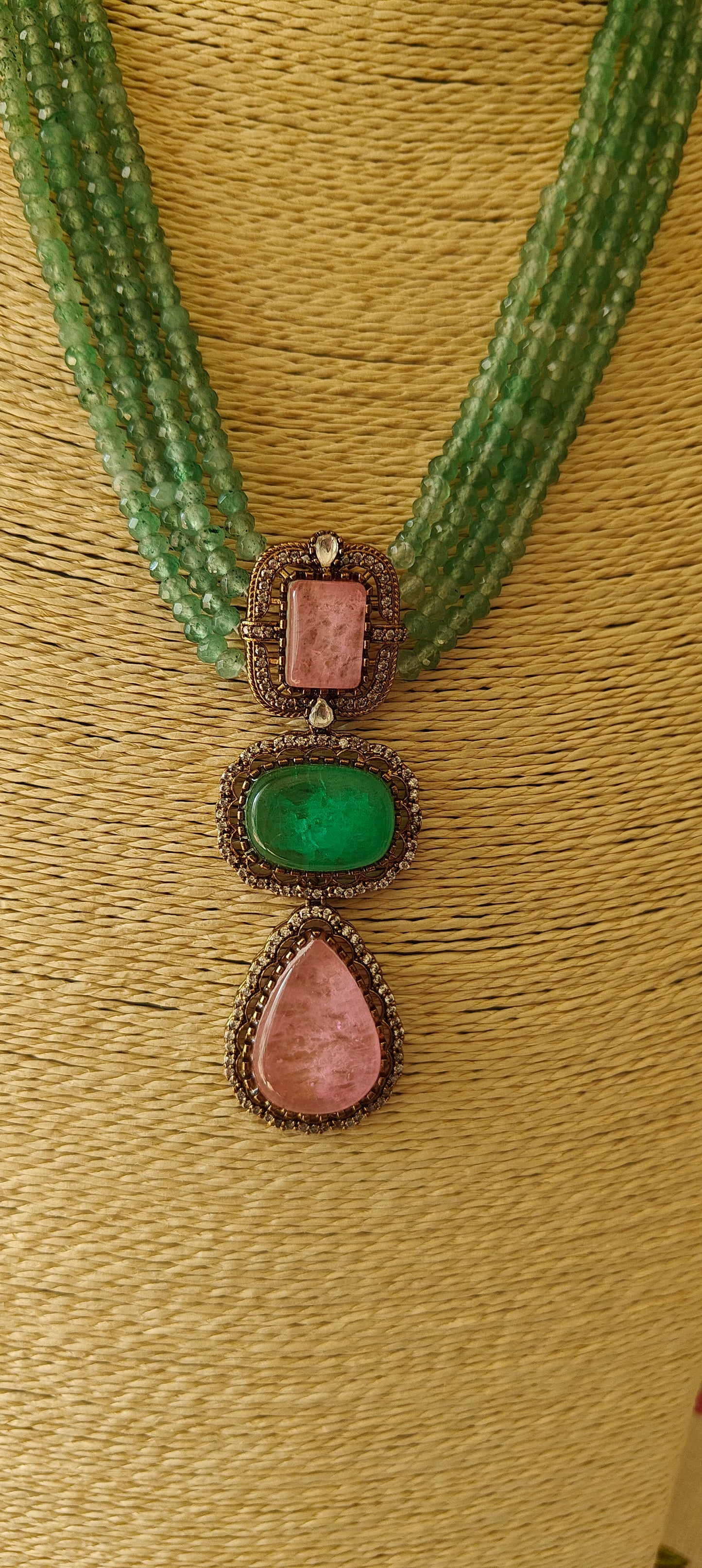 Chahana set with 4 strings of beads with stone pendant