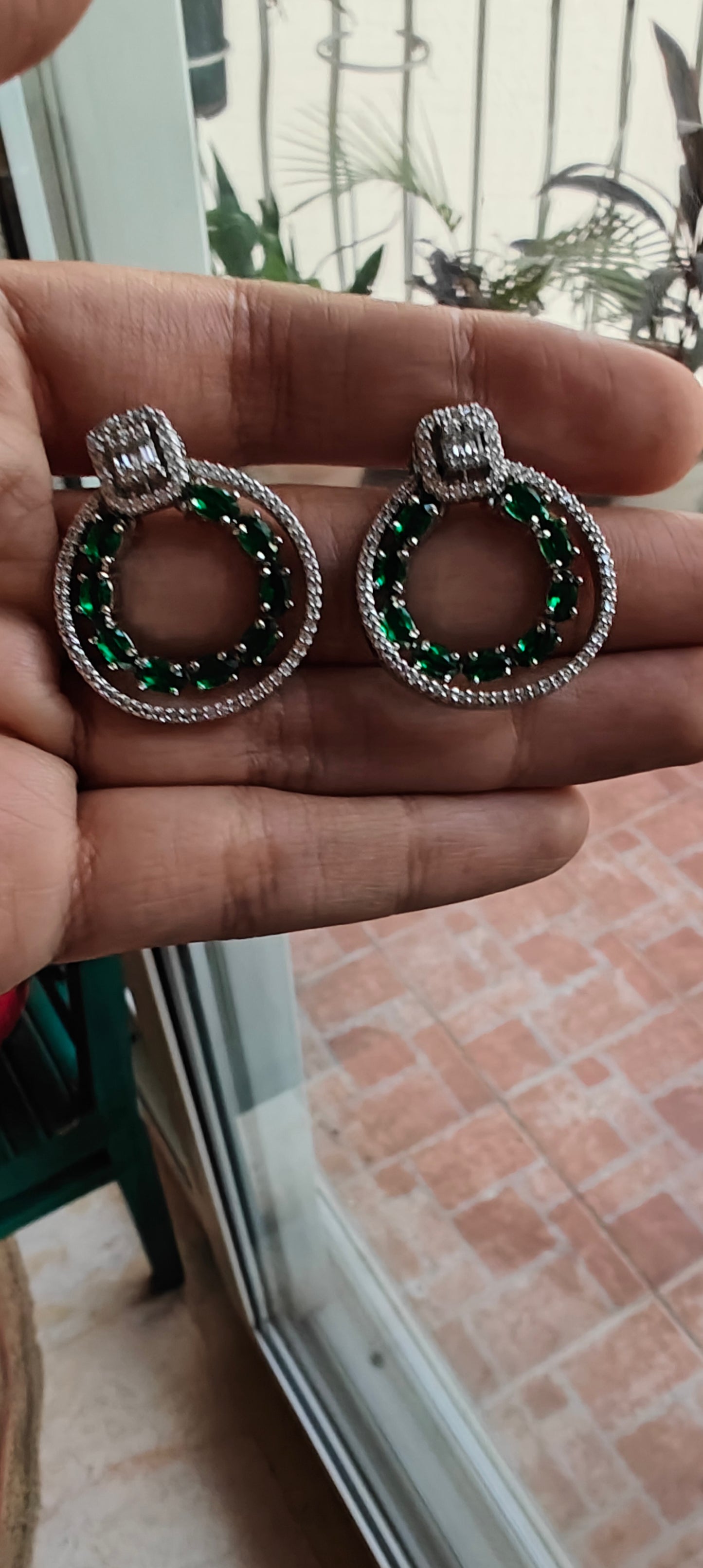 Ruby red/ emerald green circular earrings with Cz highlights