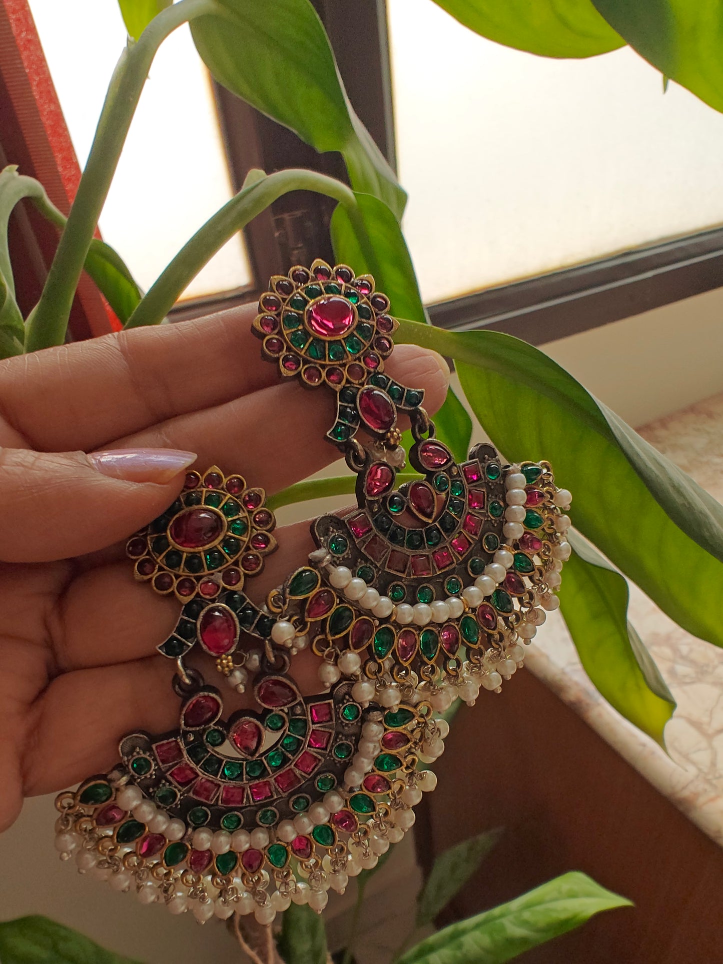 Antique gold earrings with red and green kemp stones