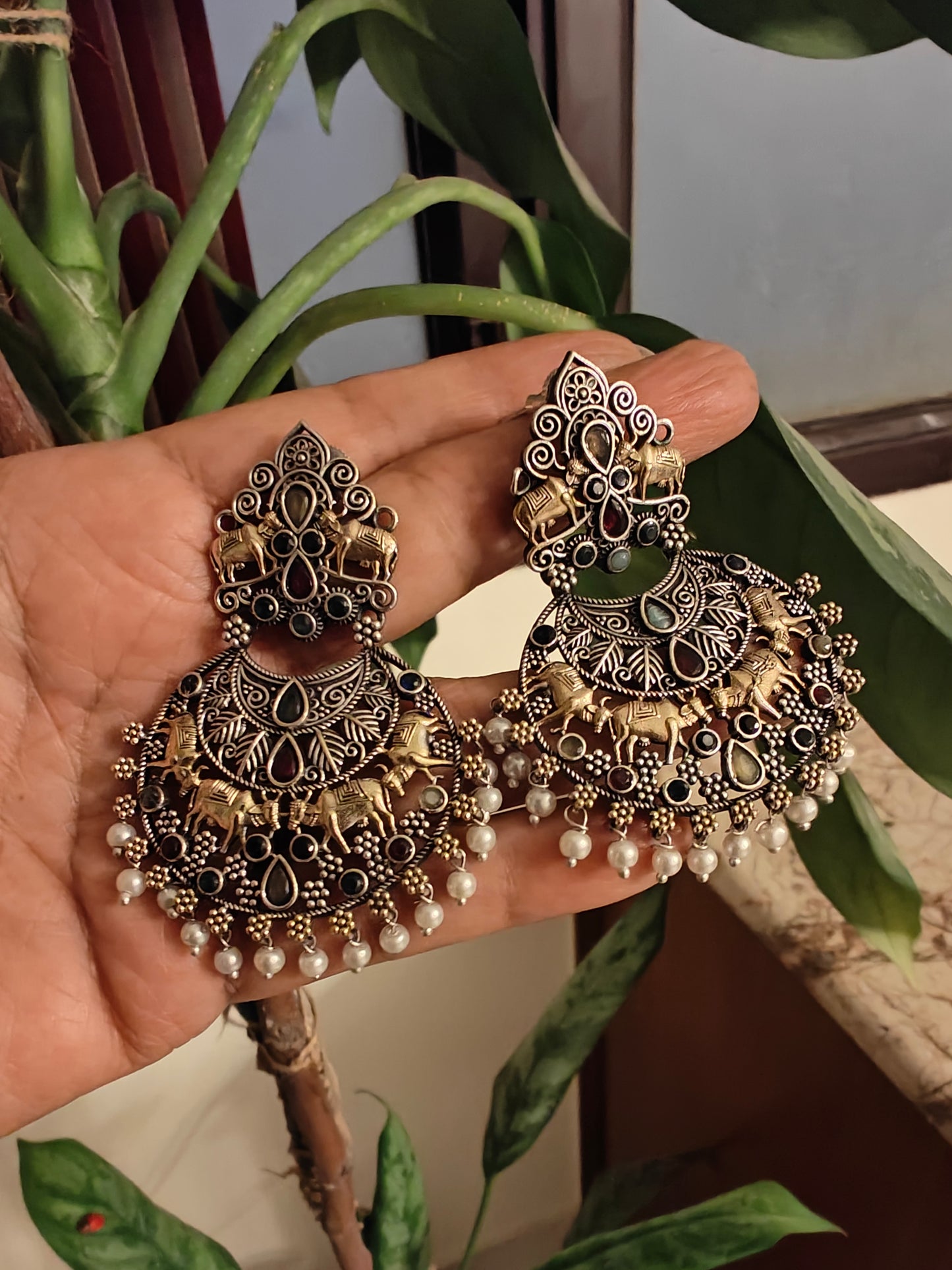 Dual tone earrings with cow motif