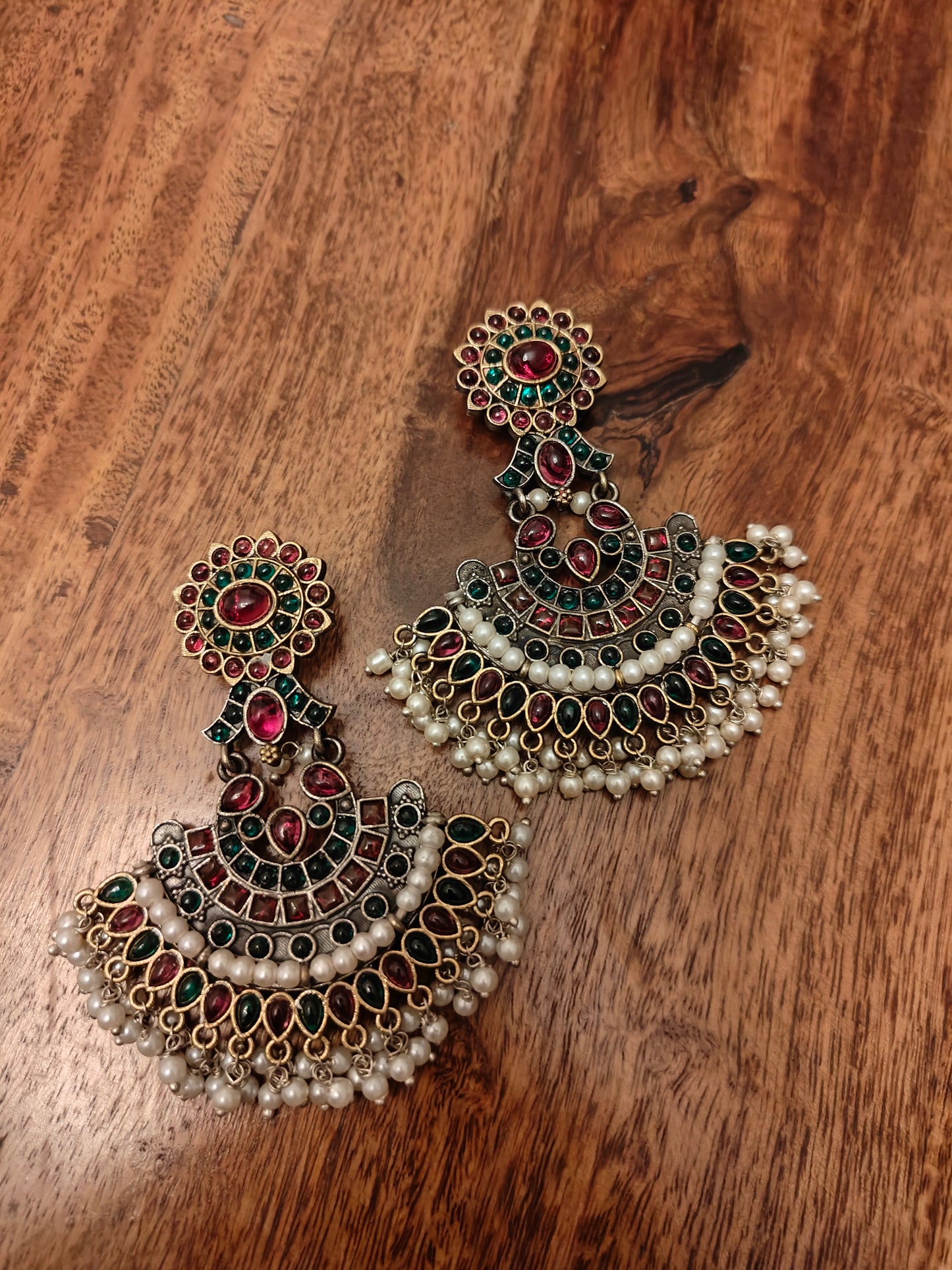 Antique gold earrings with red and green kemp stones