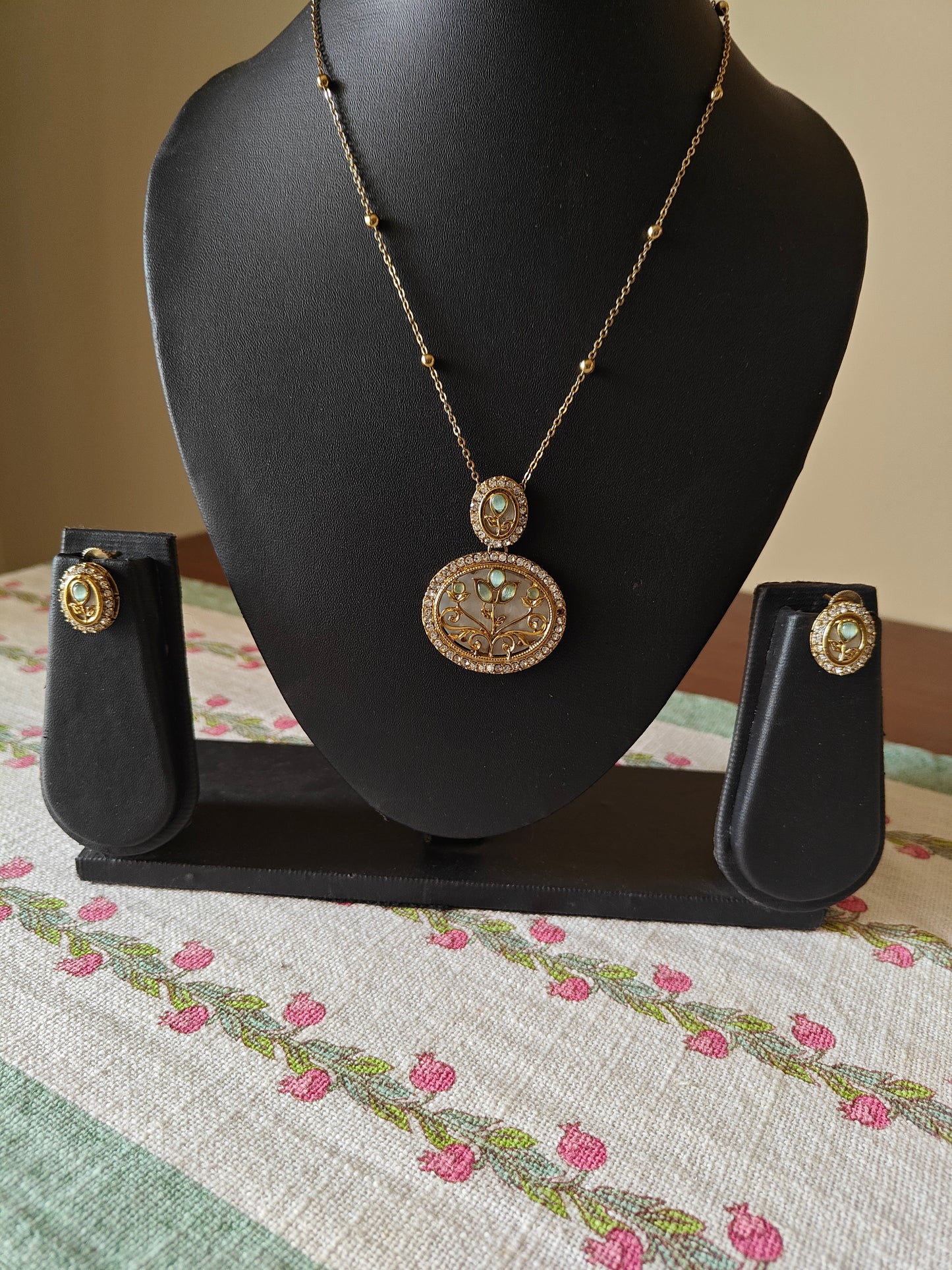 Mythily set with mother of pearl and stone work