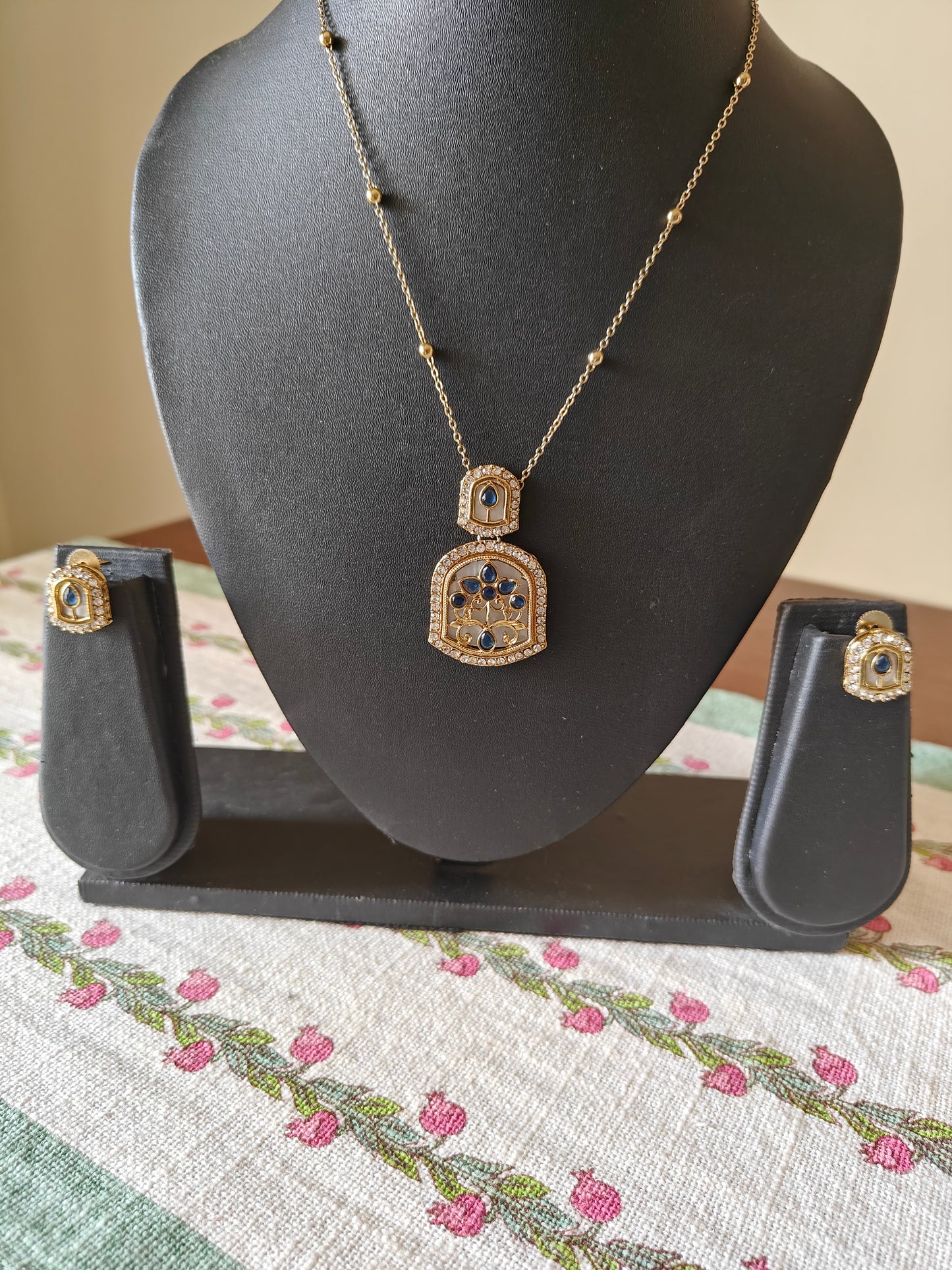 Mythily set with mother of pearl and stone work
