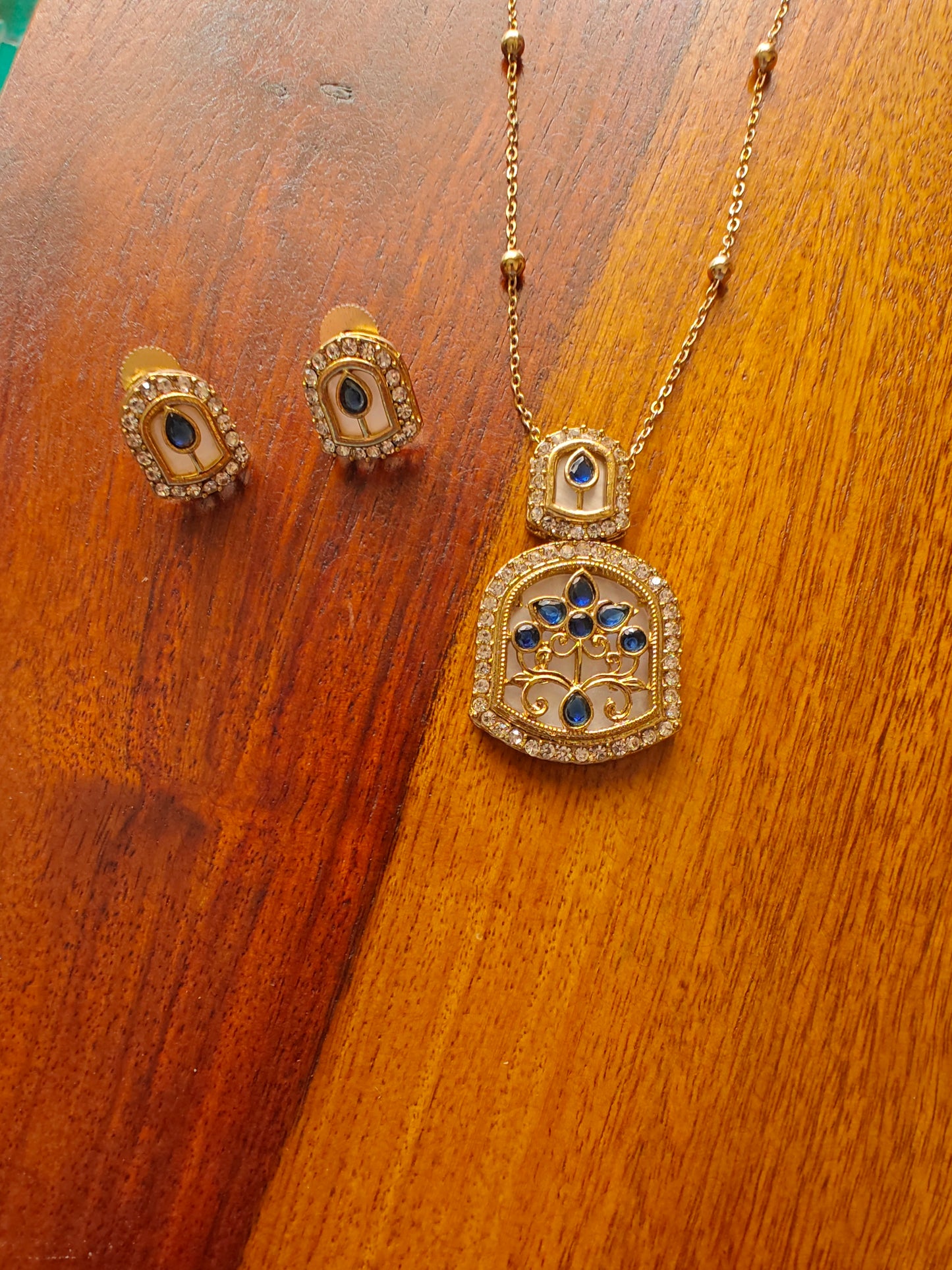 Mythily set with mother of pearl and stone work