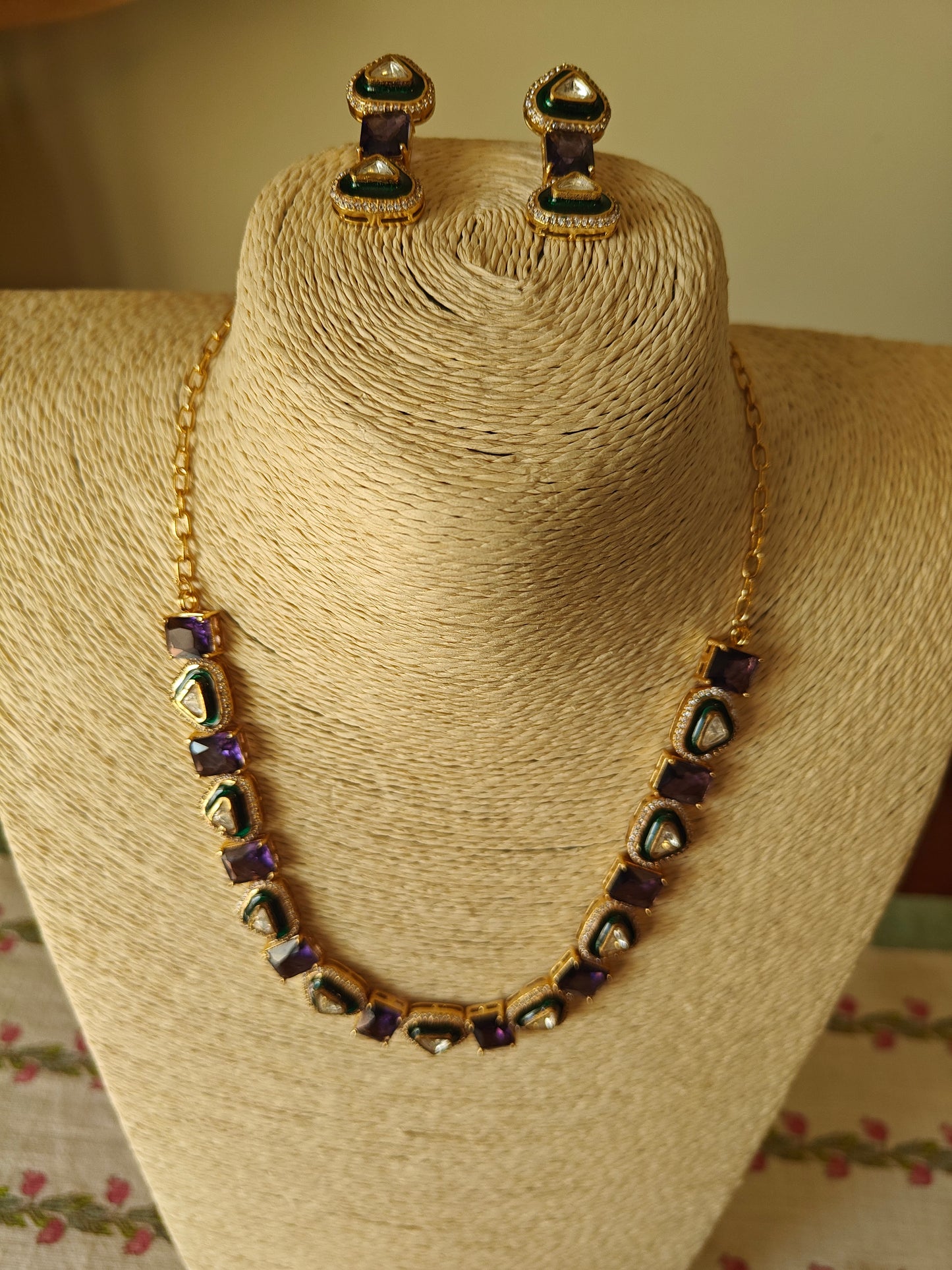 Eka set with stones alternating with triangular kundan pieces with meenakari